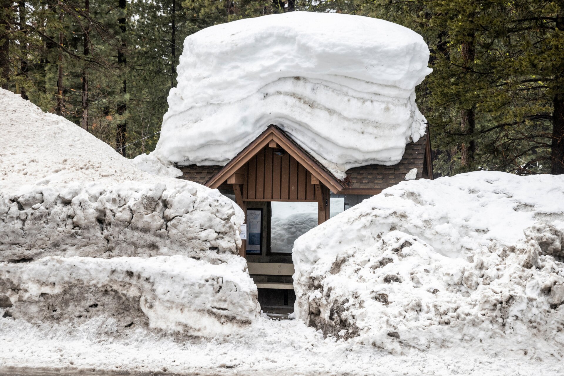 A bus shelter covered and surrounded by snow in Tahoe City, California on March 14.