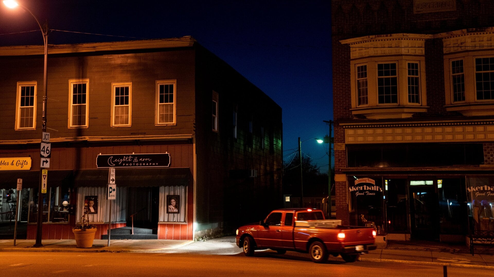 A truck turns down an alleyway on N. Market Street as dusk settles in on February 25, 2023 in East Palestine, Ohio.