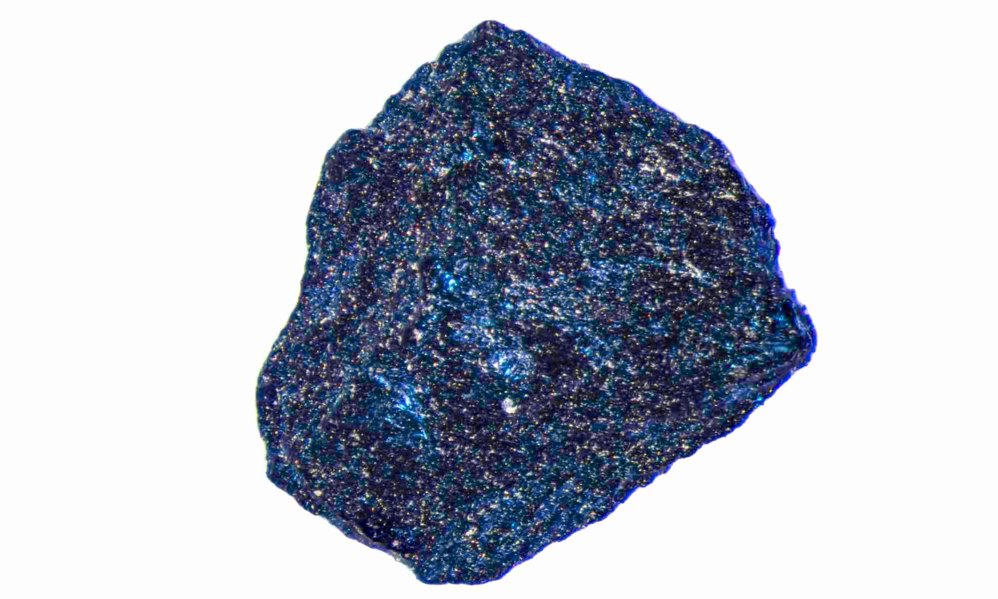A one-millimeter diameter sample of glittery, blue lutetium hydride.