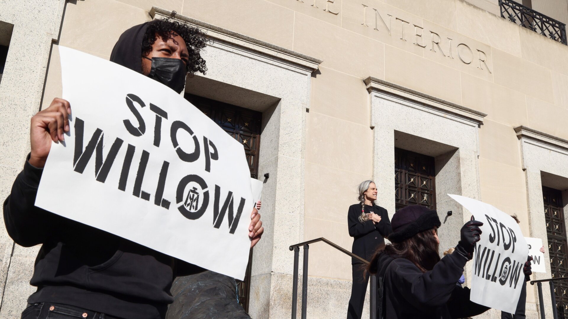 Activists protest outside the Interior Department in November.