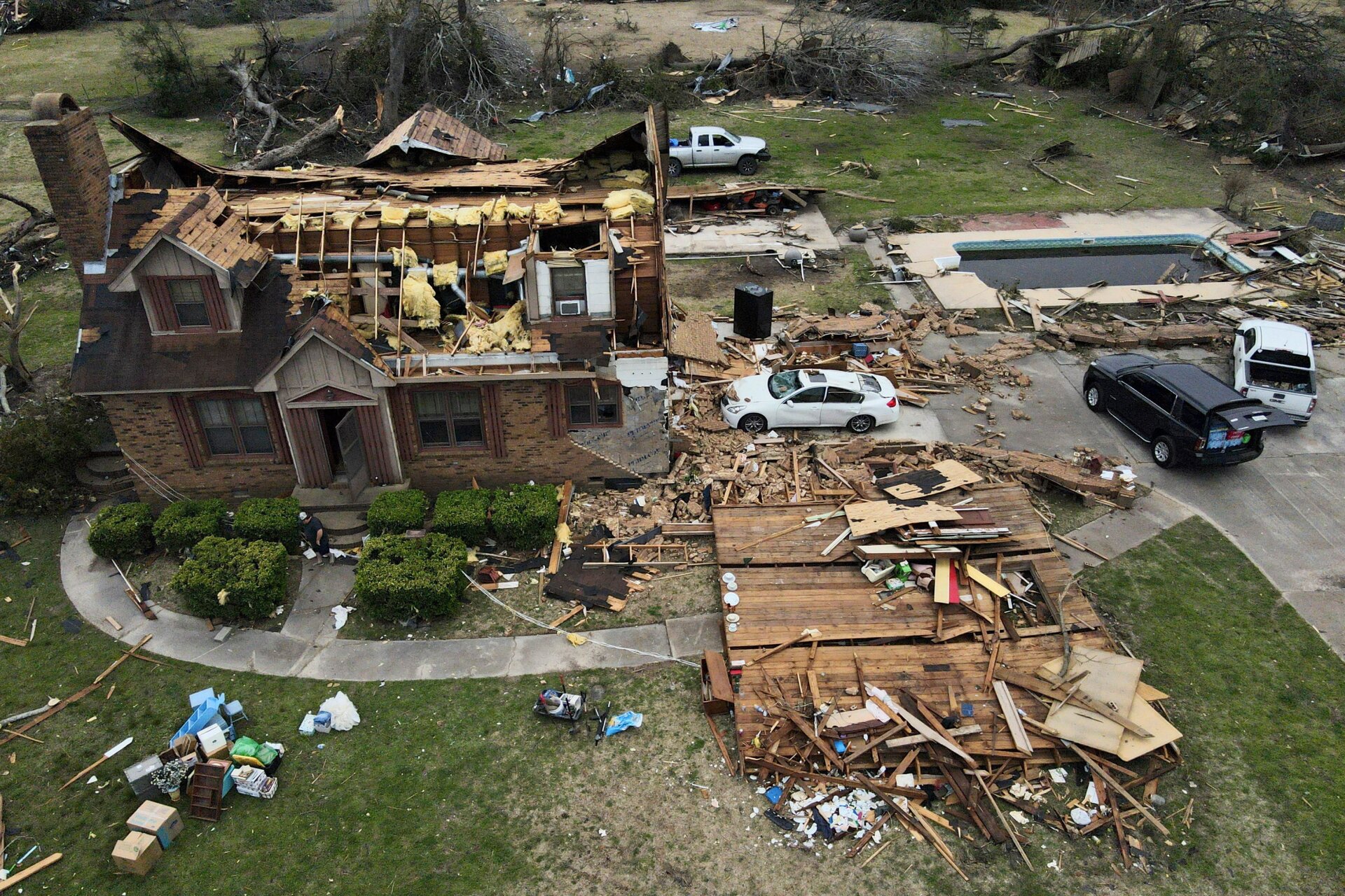 Debris is strewn about a tornado damaged home, Sunday, March 26, 2023, in Rolling Fork, Mississippi.