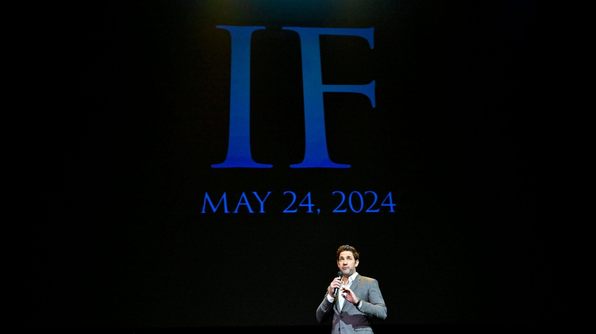 John Krasinski on stage at CinemaCon 2023, talking about IF.