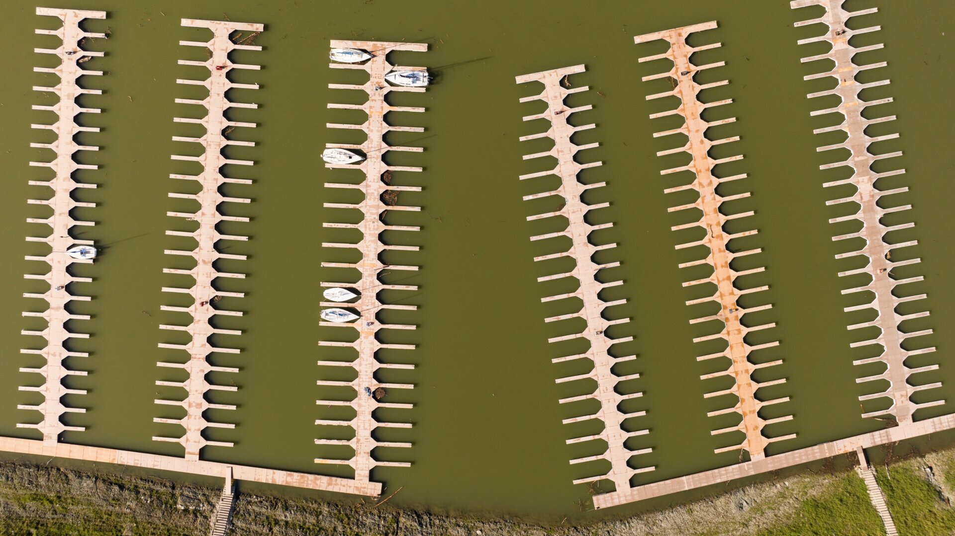 Docks float in the Browns Ravine Cove area of Folsom Lake in Folsom, California, on March 26, 2023.