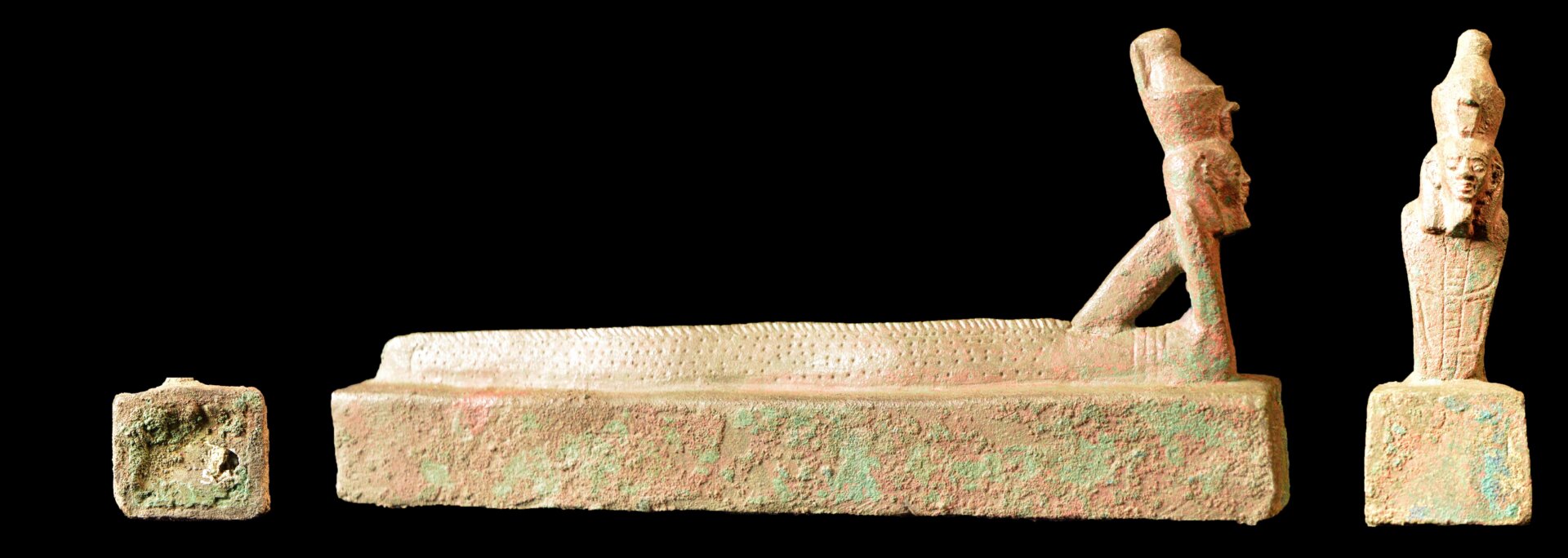 A second box with a human-headed eel-cobra figure.