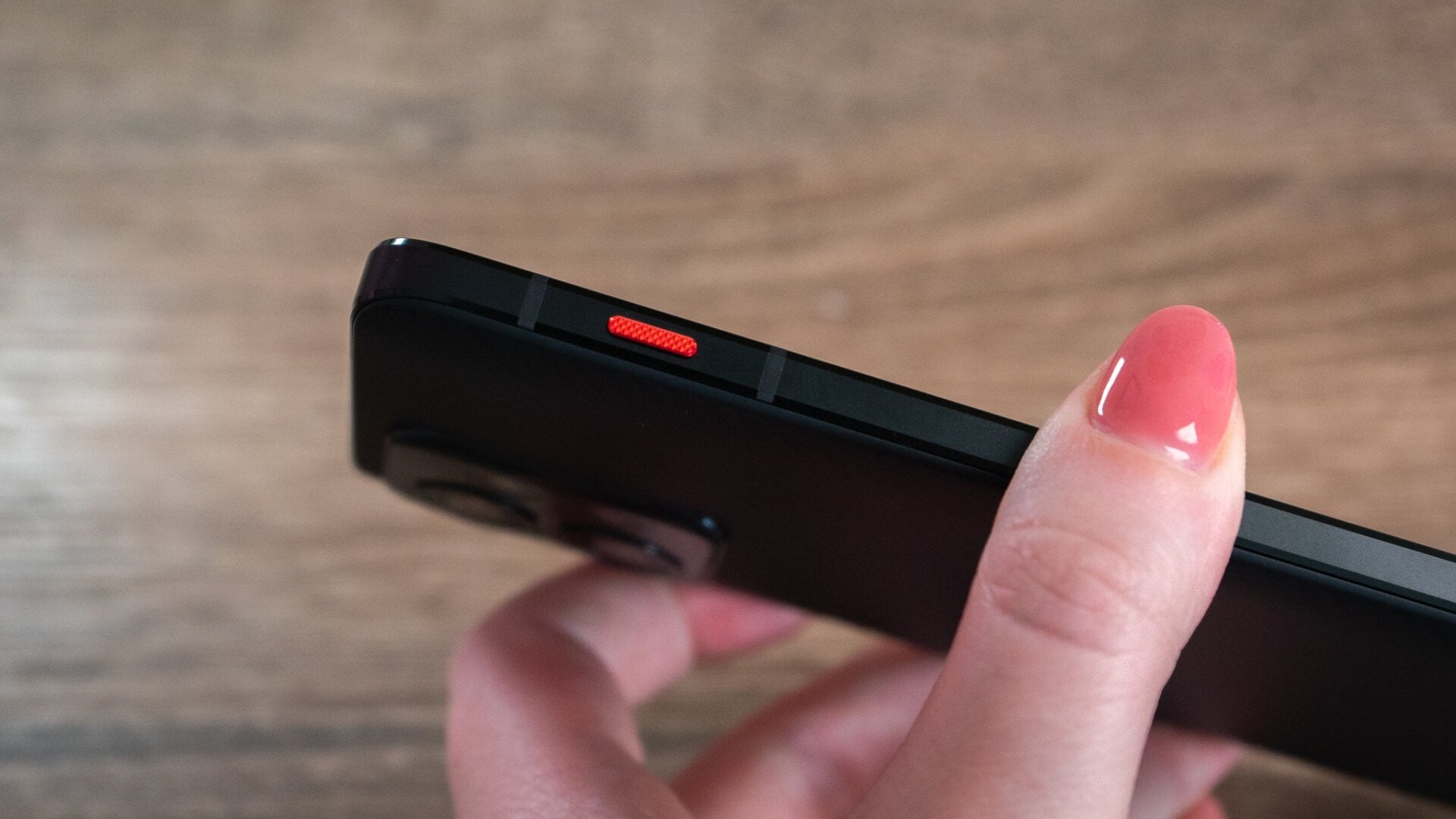 This red shortcut button is programmable. 