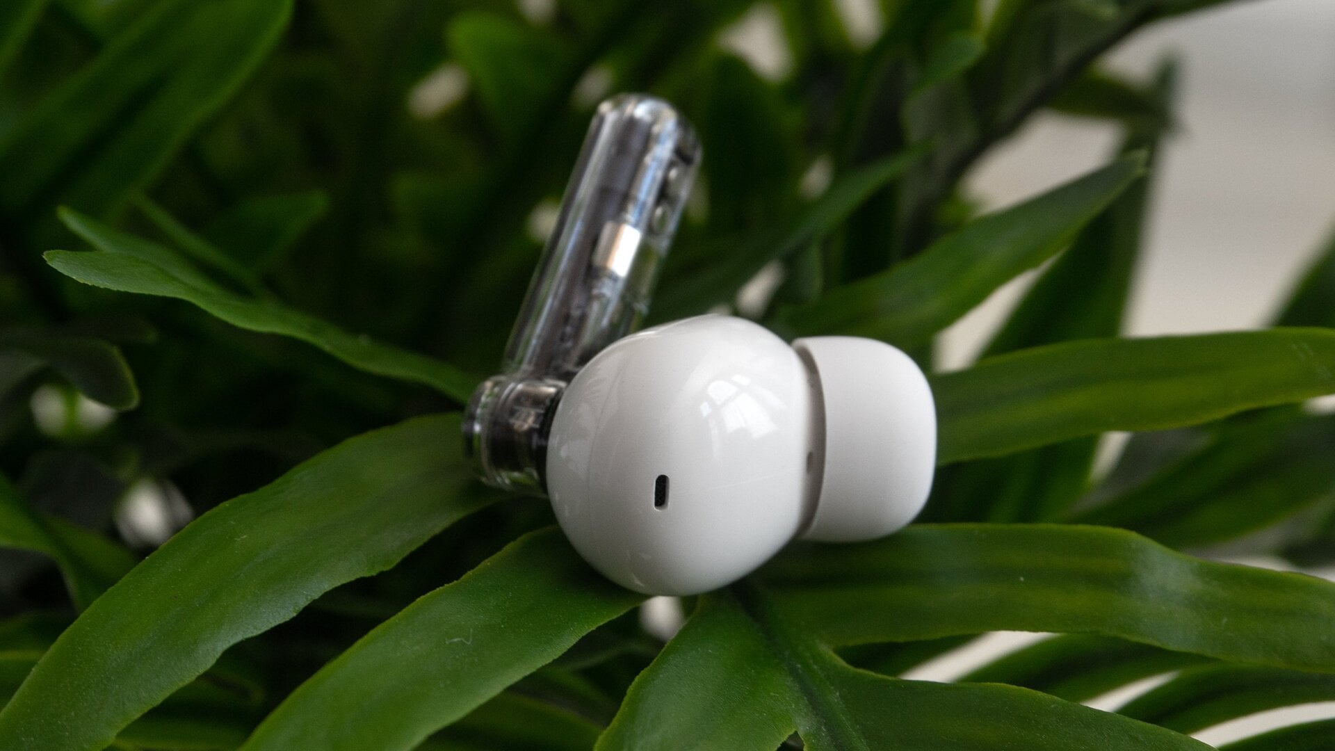 The Nothing Ear (2) earbuds are nearly identical to the Ear (1)‘s, aside from a different label, and the location of one of the microphones.