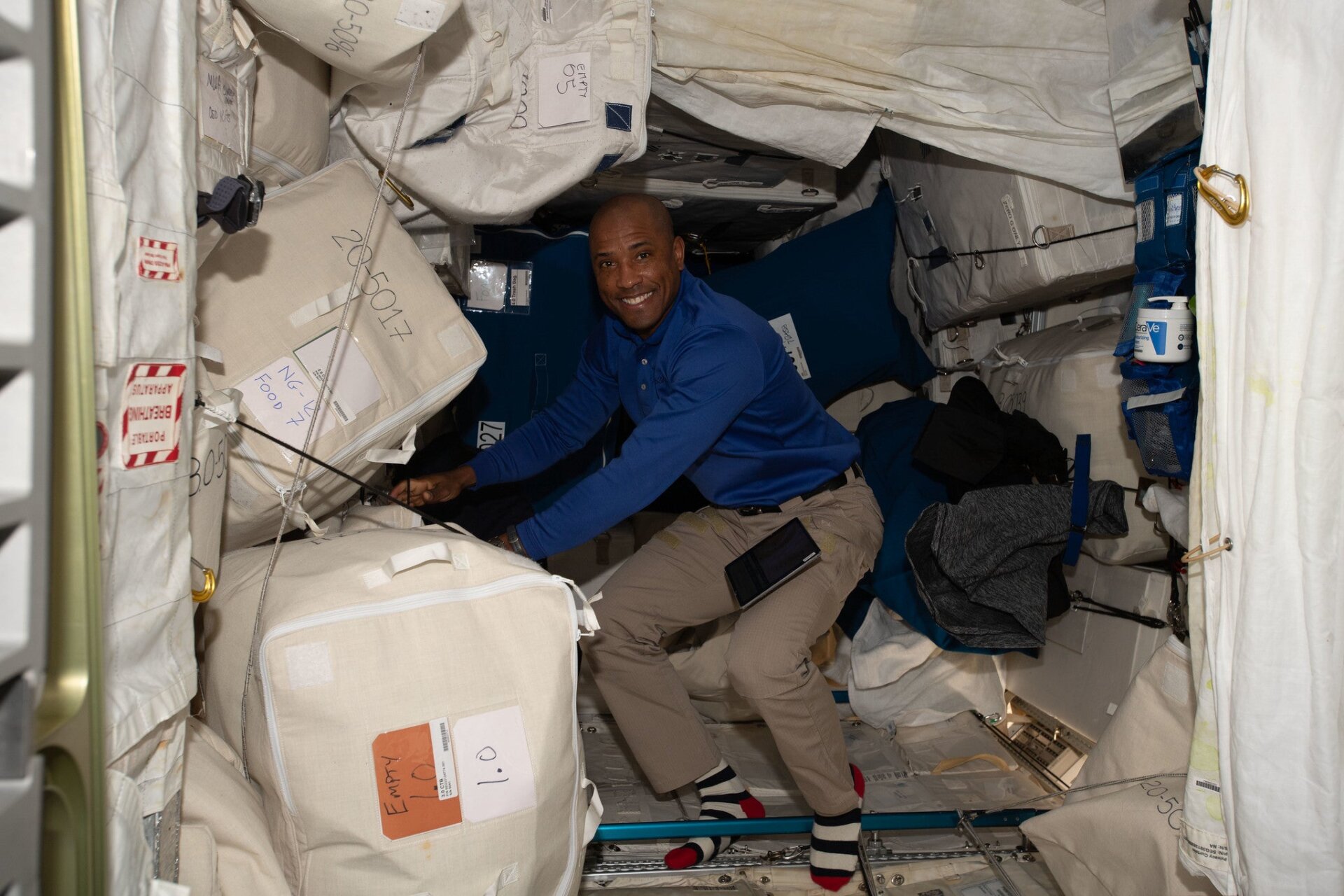 Glover sorting through cargo on the ISS, November 30, 2022.