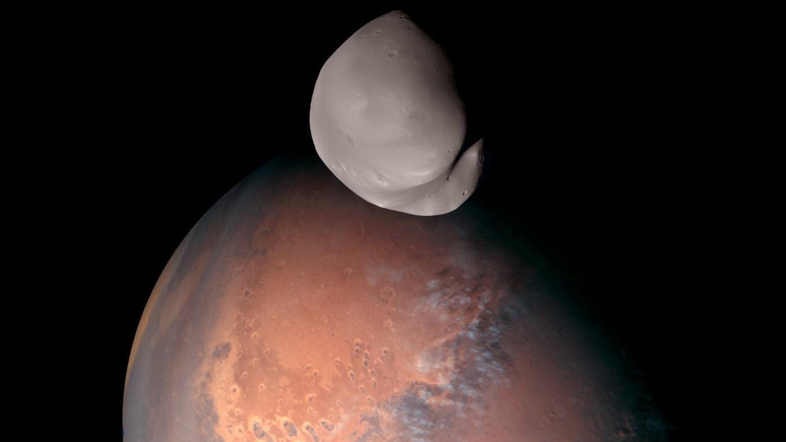 Composite image of Mars’ moon Deimos as it orbits the planet taken by the Hope probe.