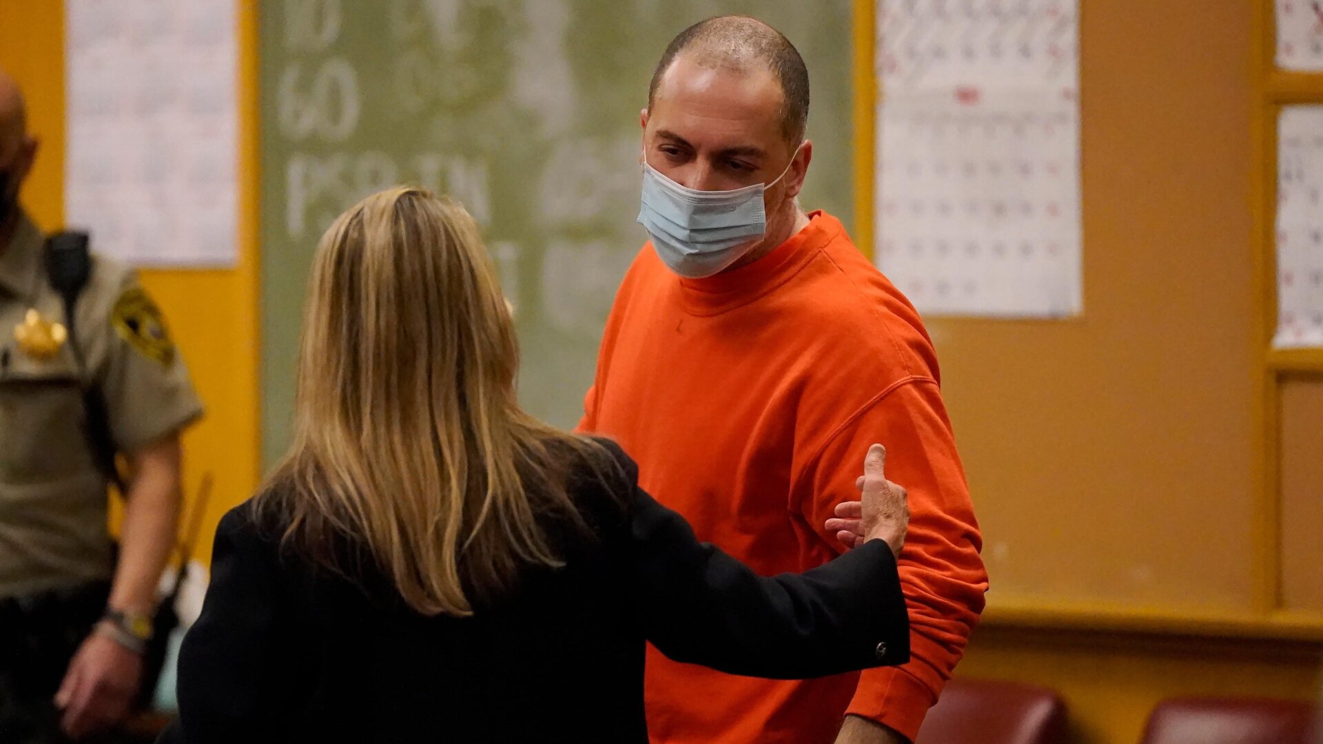 Nima Momeni speaks with his attorney Paula Canny in San Francisco court on Tuesday, April 25.