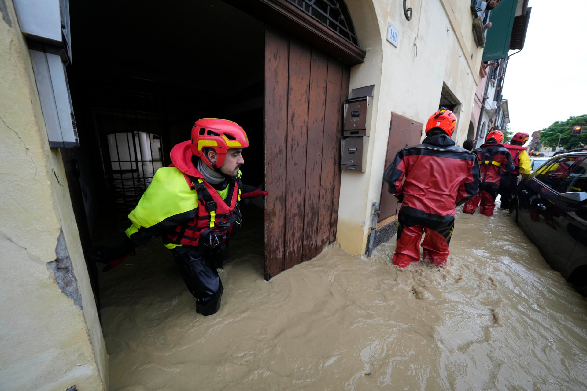 Rescue workers search flooded buildings on May 17 in Castel Bolognese to check for casualties and people in need of help. 