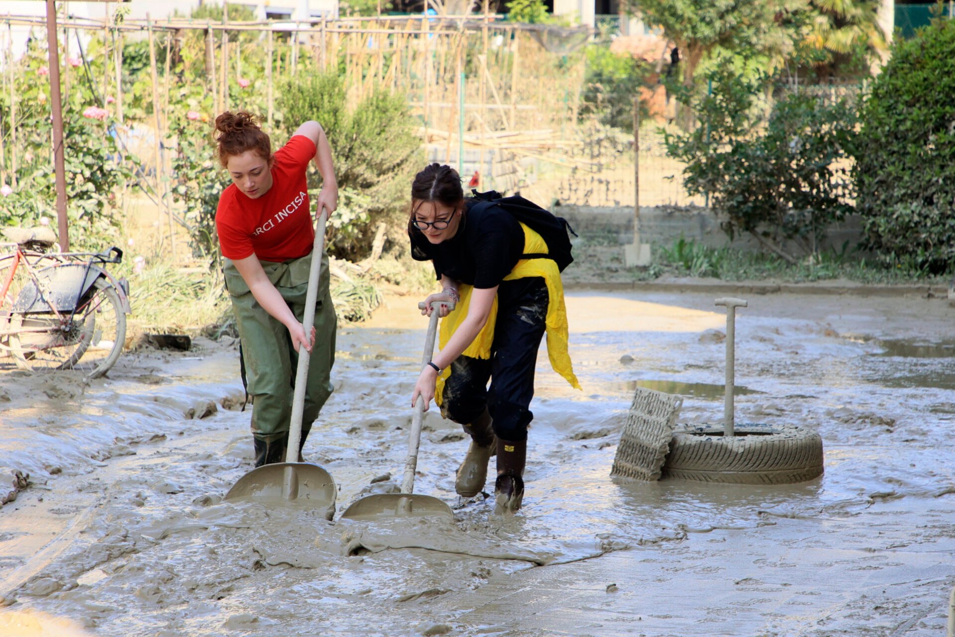 Even after water recedes, mud is left behind by flooding and landslides. Volunteers work to clear some of the much in Faenza, Italy on May 22. 