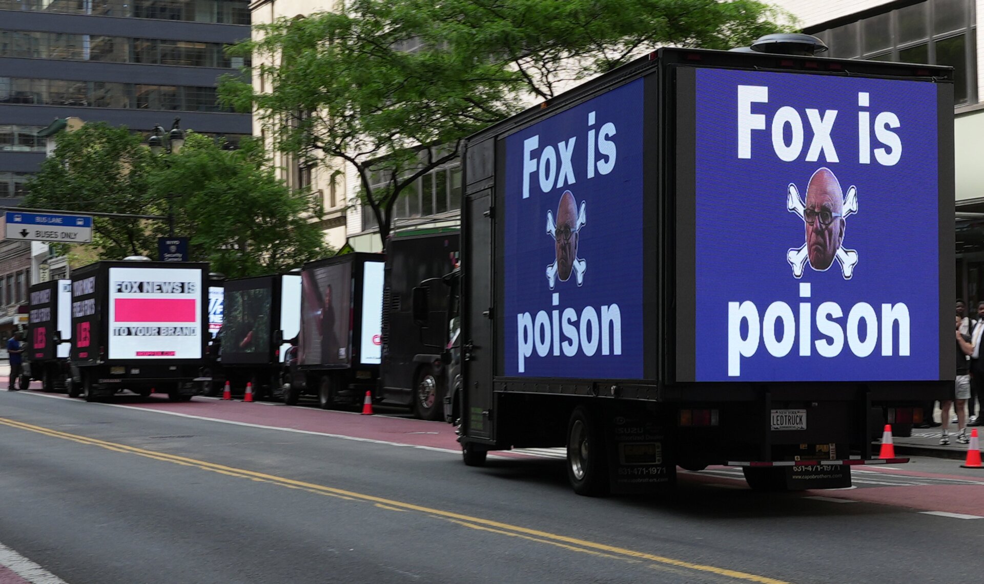 Billboard trucks from several protest groups lined the street in front of the Manhattan Center Monday during Fox New’s Upfront conference.