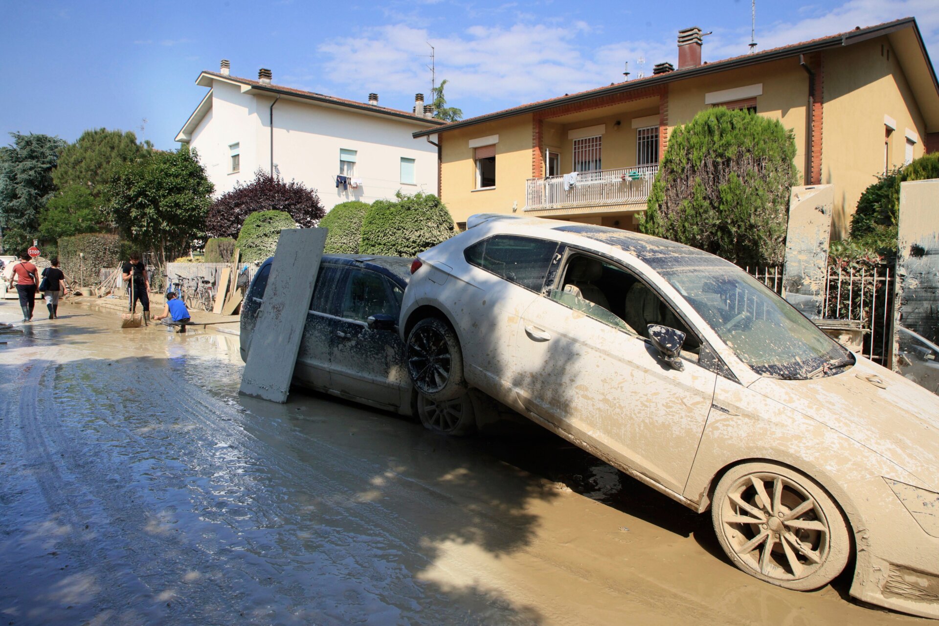 Floodwaters were powerful enough to move vehicles. One car sits piled atop another in Faenza Italy on May 22, in the aftermath of heavy flooding. 