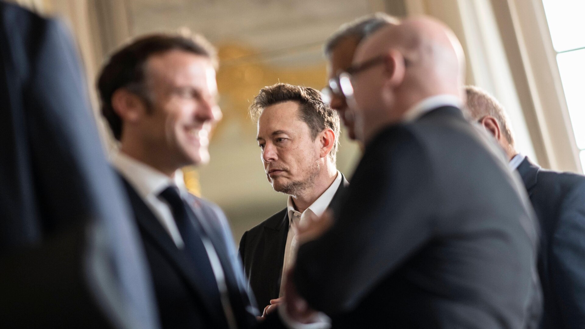 Boy genius Elon Musk at a political summit in France.