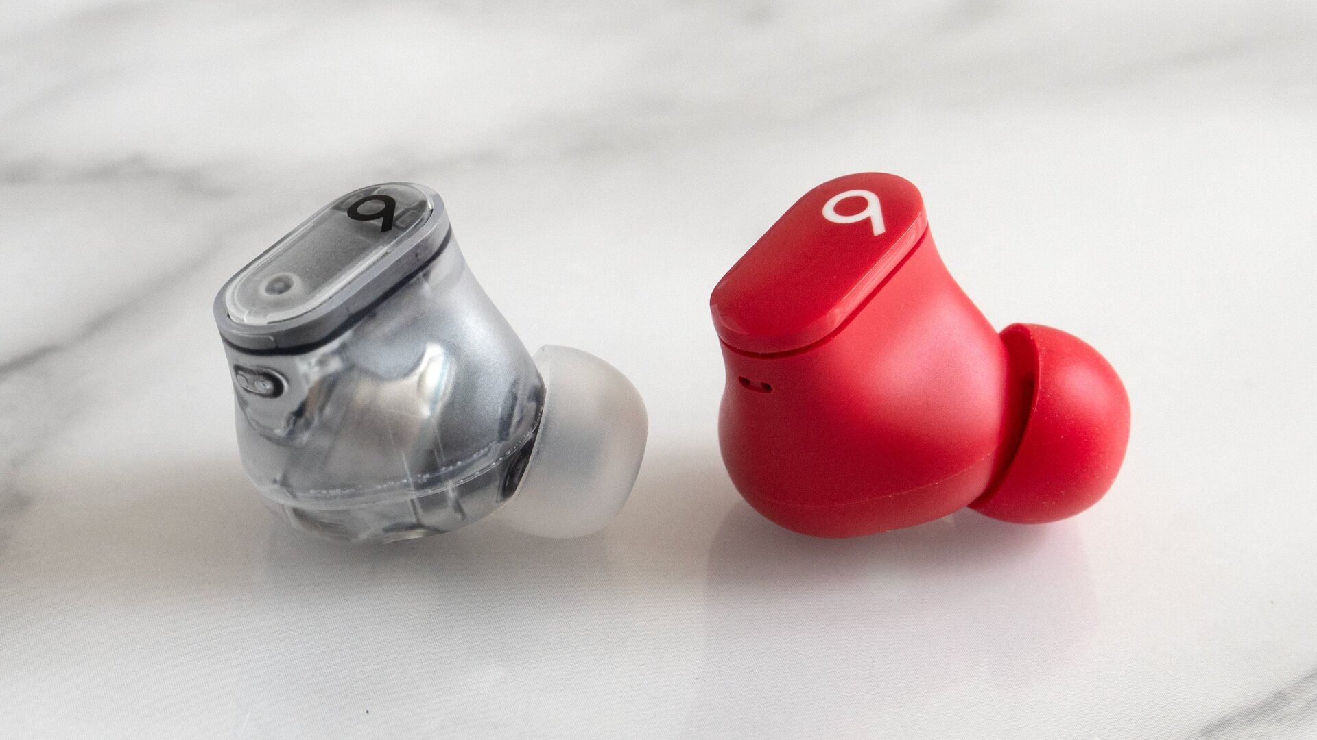 Users of the original Beats Studio Buds (right) will appreciate the upgraded design of the shortcut button on the Beats Studio Buds + (left), which is harder to accidentally press while handing the earbuds.