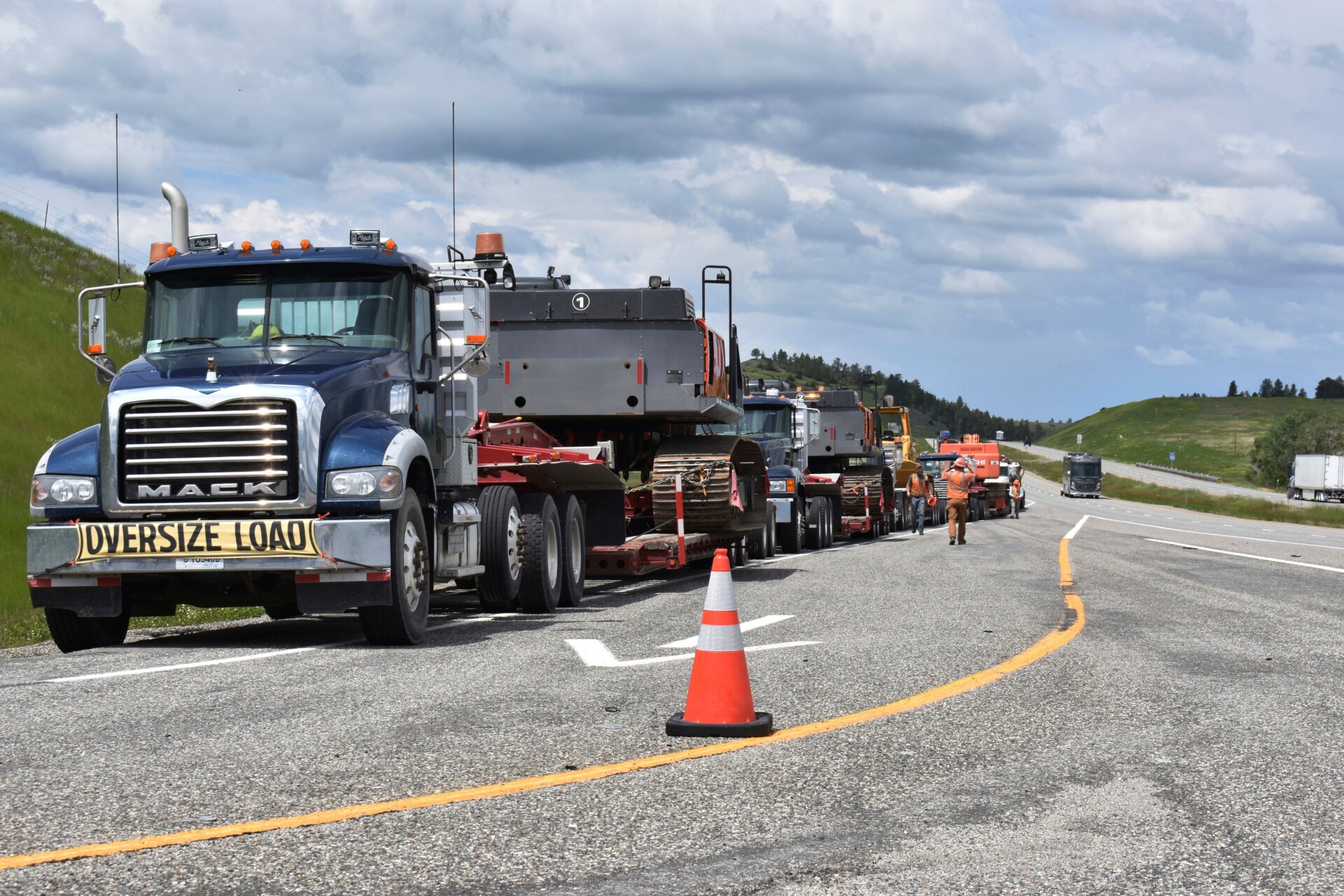 Local authorities are on the scene as heavy equipment is staged to begin removing the wreckage after a bridge collapse near Columbus, Montana, on Saturday, June 24, 2023.