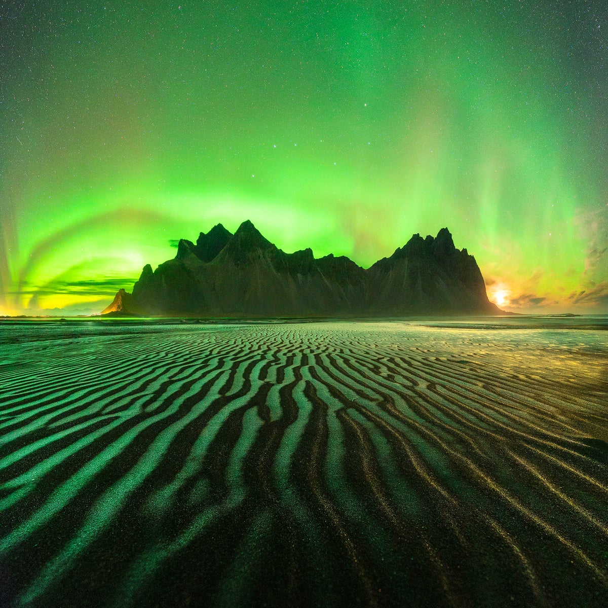 The Northern Lights over Vestrahorn, a mountain in Iceland.