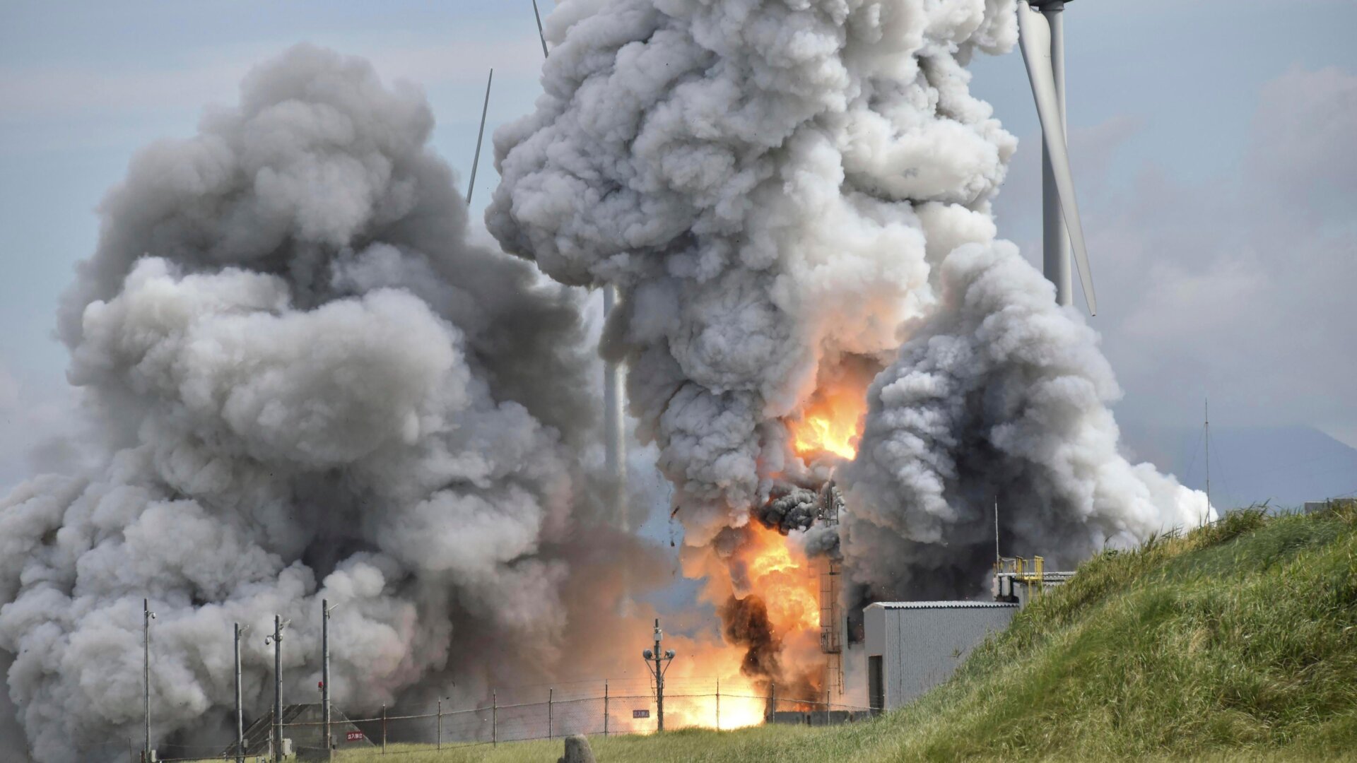 Smoke rises as an engine for an Epsilon S rocket exploded during a test at the Japan Aerospace Exploration Agency’s testing site in northeastern Japan, July 14, 2023