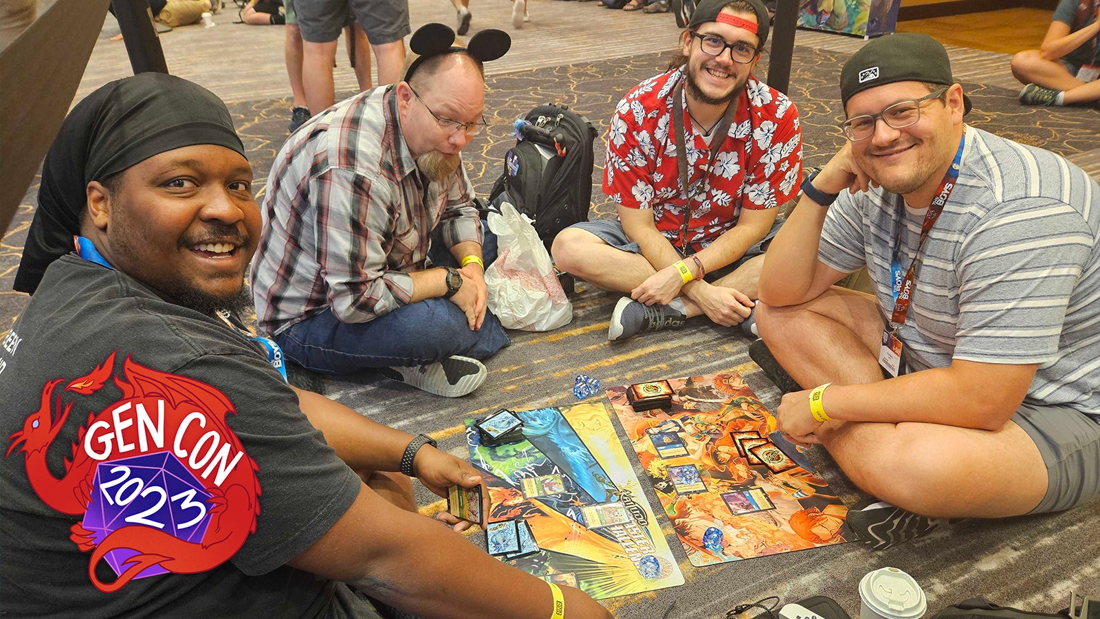 Tracy Bowling, Carl Redditch, Asa Anderson-Proctor, and Chris Martin play Lorcana in the product line this morning.