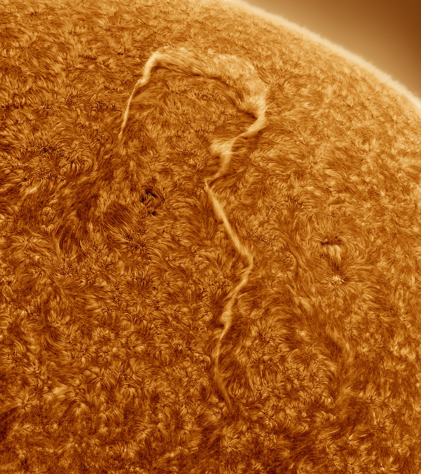 A filament arcing across the Sun’s surface.