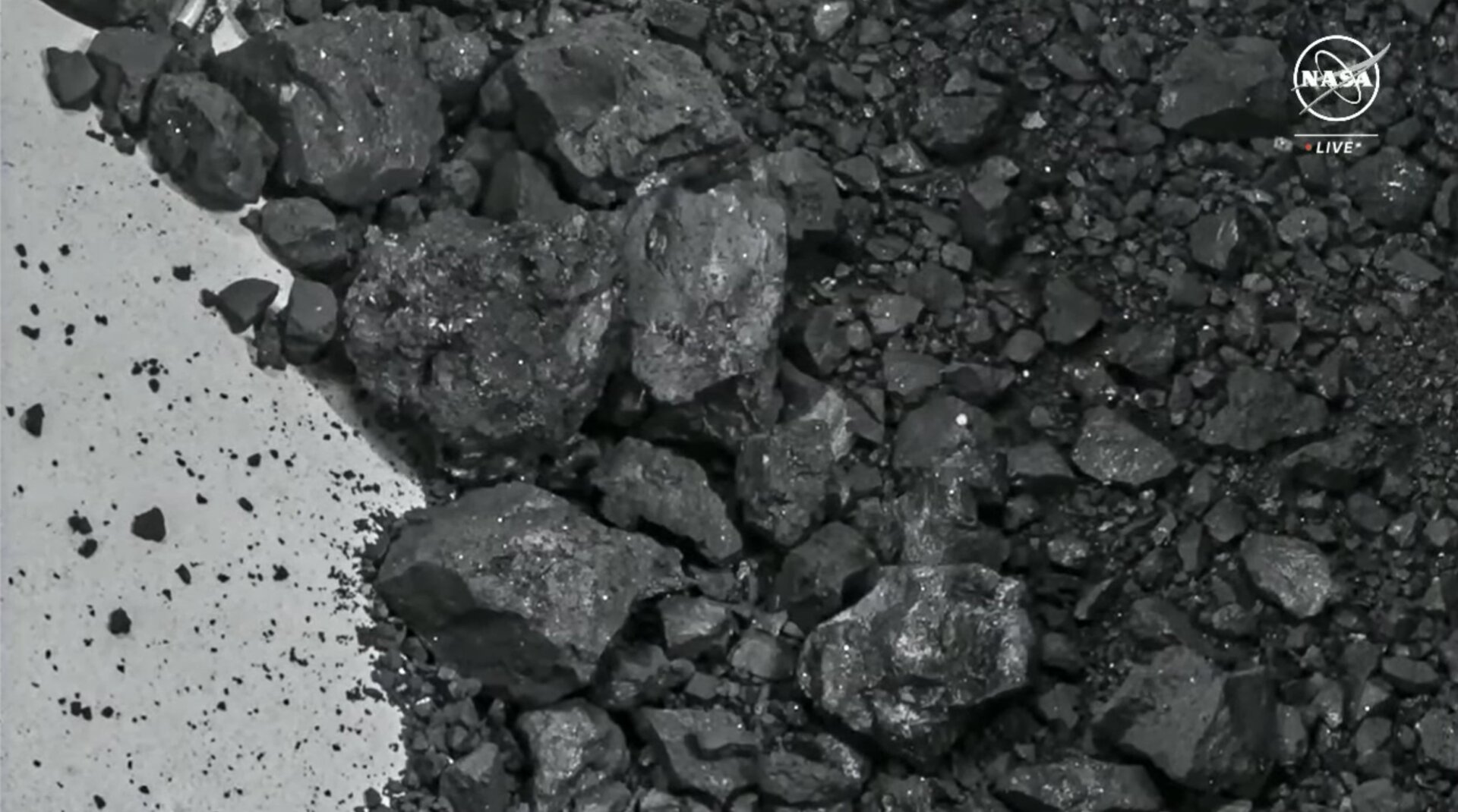 A closer view of the asteroid material, all found on the canister exterior.