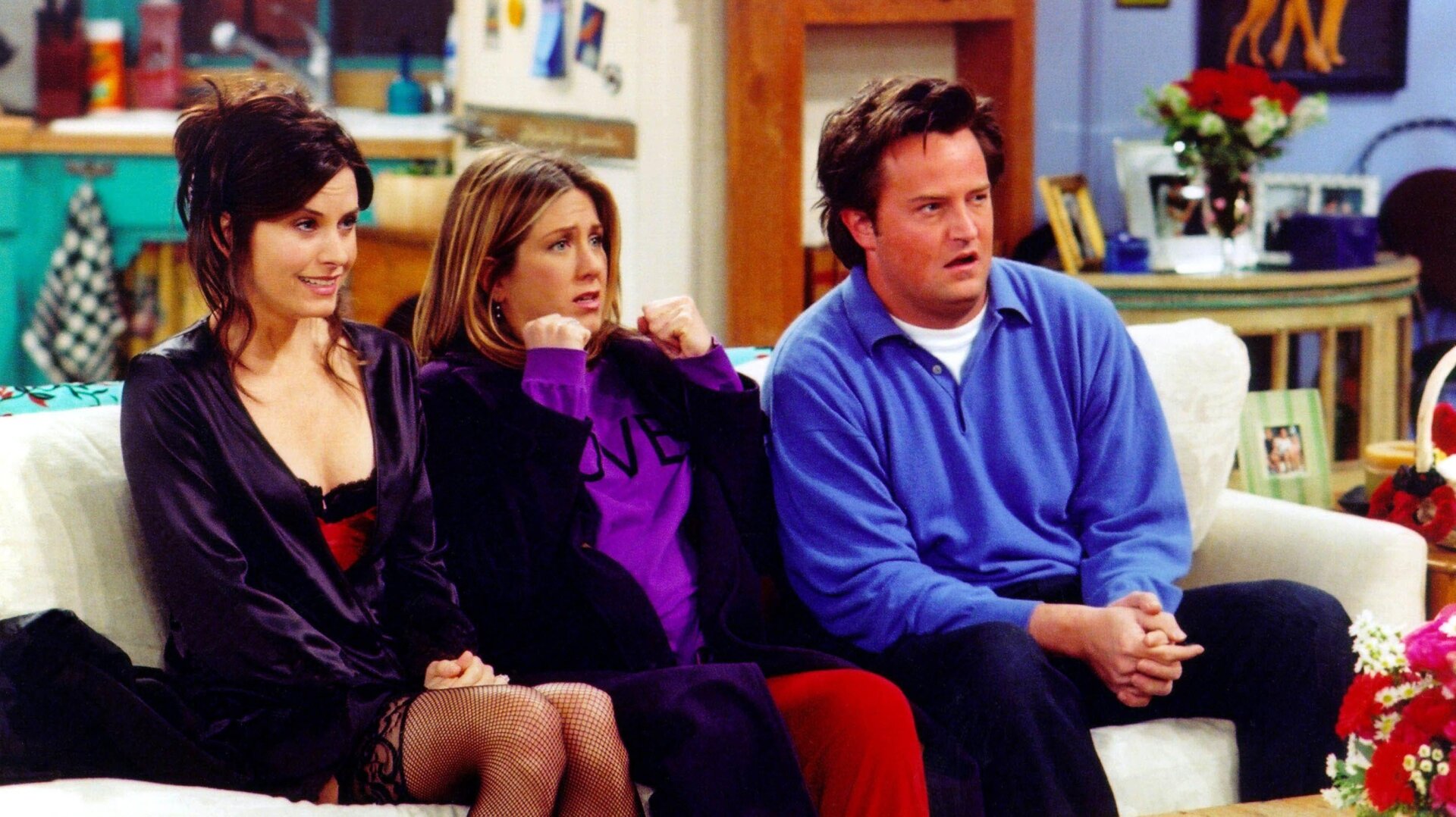 Courteney Cox, Jennifer Aniston, and Matthew Perry in a scene from the NBC series Friends.