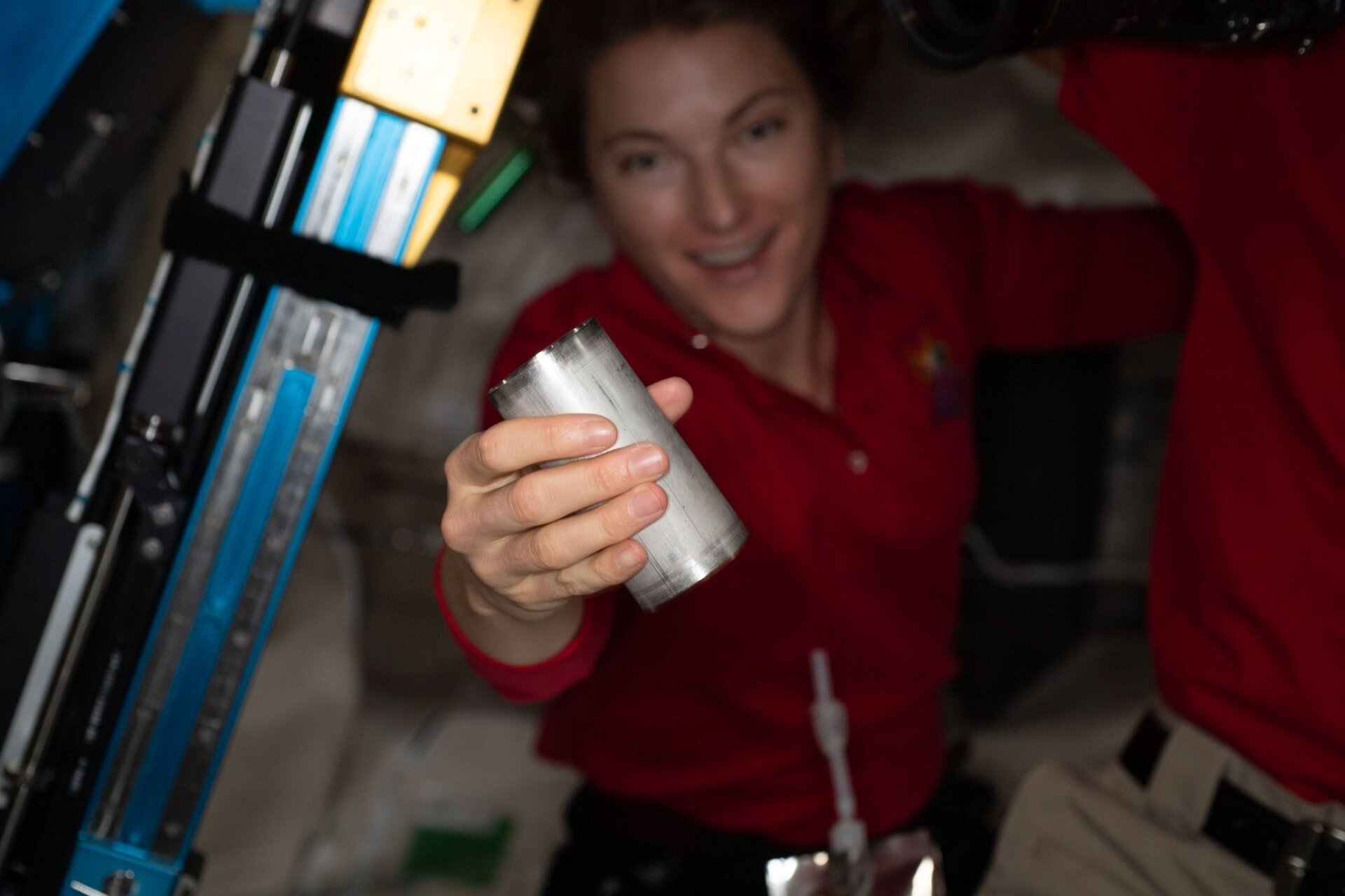 NASA astronaut Kayla Barron exchanging a filter in the space station’s Brine Processor Assembly.