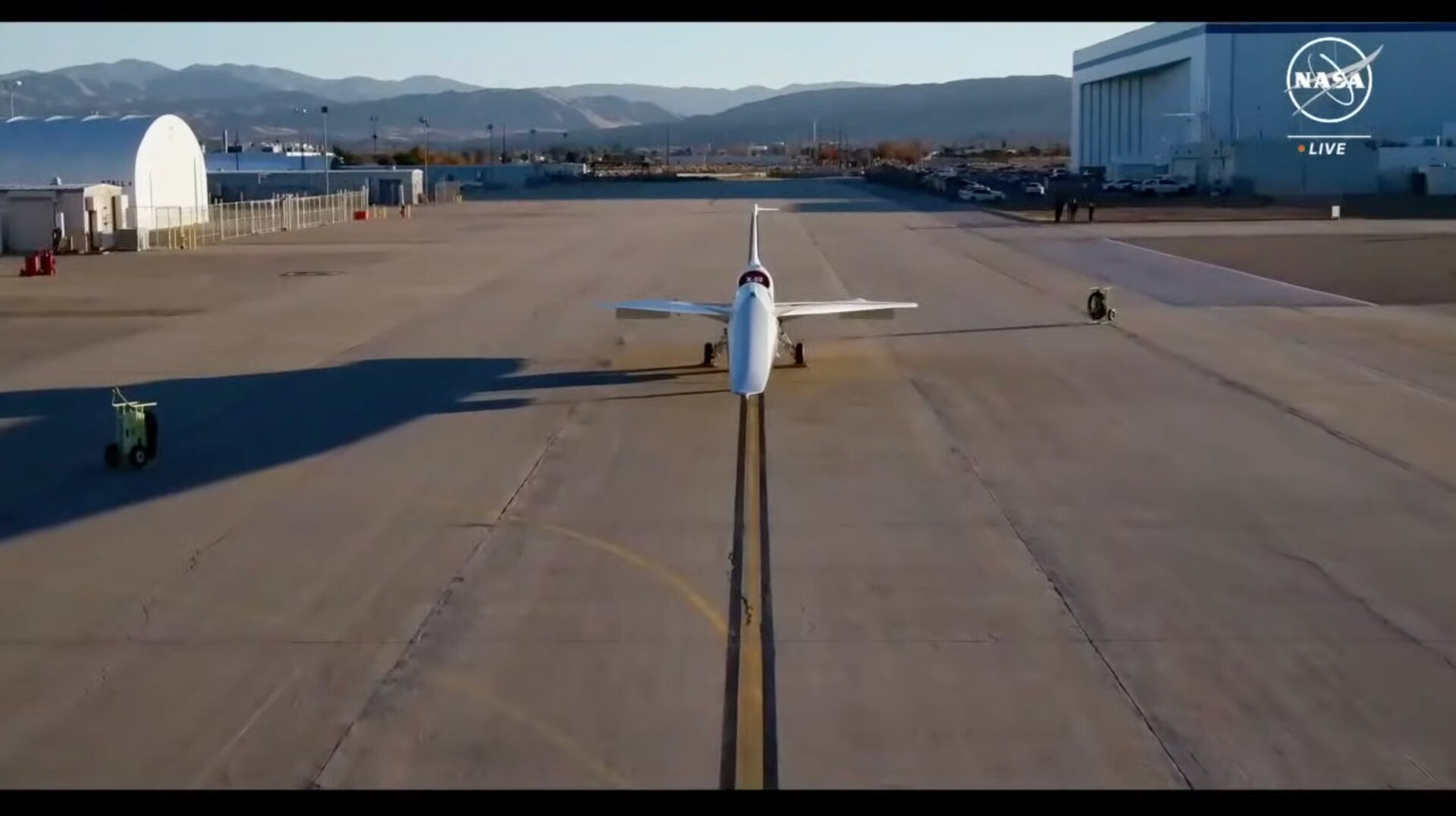 A view of the X-59 outside its hangar.