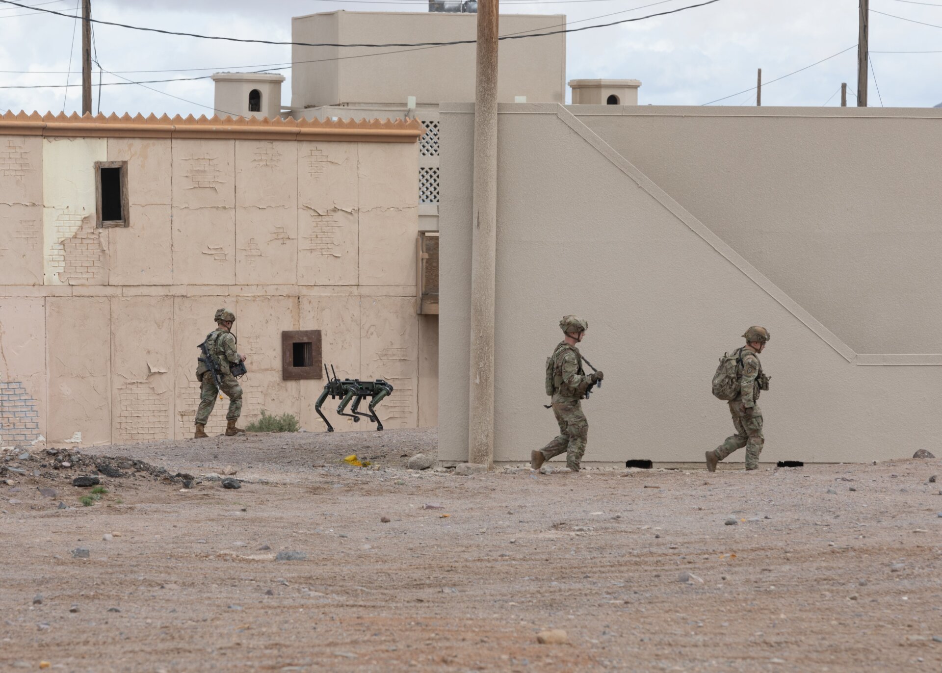 A Quadruped Ghost robotic dog is deployed as part of an urban assault  during a series of Human Machine Integration experiments in a training  environment as part of Project Convergence – Capstone 4 at Fort Irwin,  Calif., March 16, 2024.