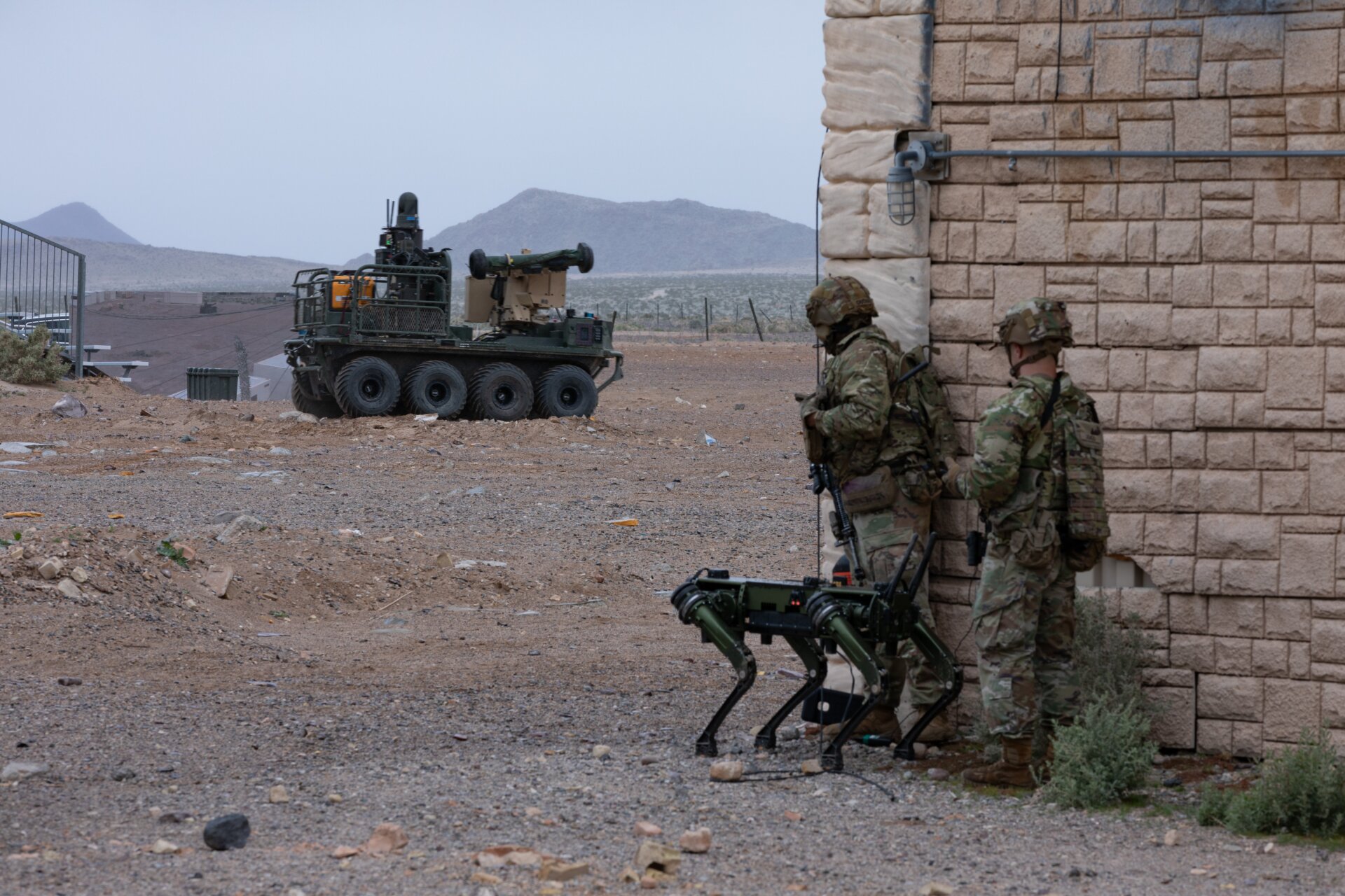 U.S. Soldiers assigned to the 1st Battalion, 29th Infantry Regiment,  based out of Fort Moore, Ga., take part in a human machine integration  demonstration using the Ghost Robotic Dog, and the U.S. Army Small  Multipurpose Equipment Transport (SMET) of new U.S. Army capabilities at  Project Convergence - Capstone 4 in Fort Irwin, Calif., March 15, 2024.