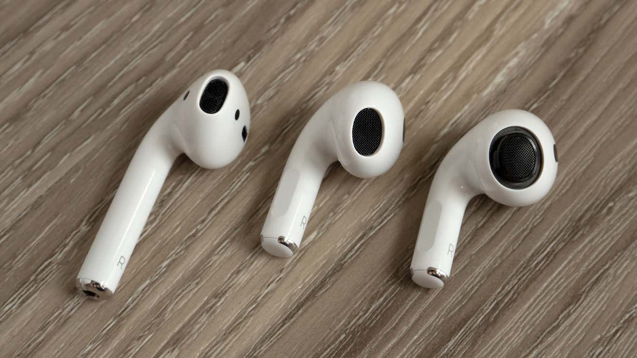 The AirPods 2nd Generation (left) compared to the AirPods 3rd Generation (center) and the discontinued AirPods Pro with the silicone tip removed (right).