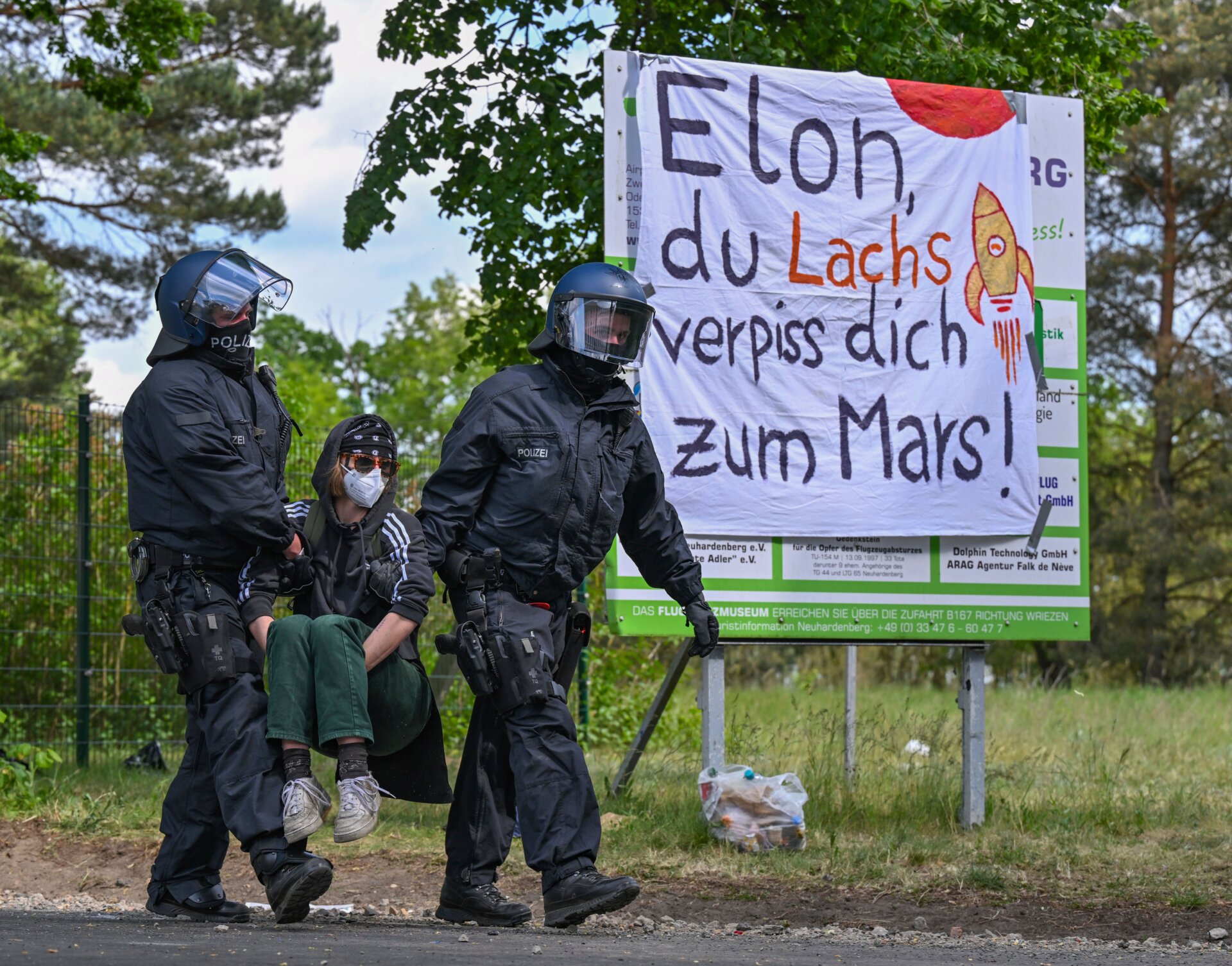  Police clear a blockade by activists at the access road to Neuhardenberg airfield on May 10, 2024.