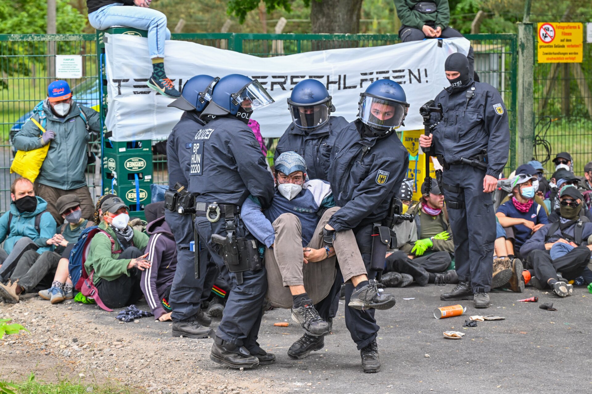 Police clear a blockade by activists at the access road to Neuhardenberg airfield on May 10, 2024. 