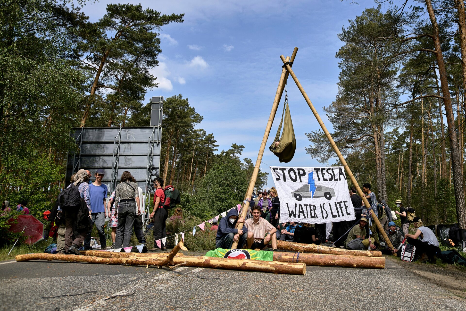 Activists block a road during a protest against Tesla on May 10, 2024.