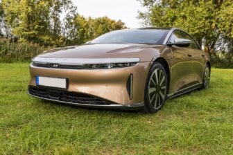 LUCID AIR luxury car on a meadow near the forest. Modern electric car LUCID.