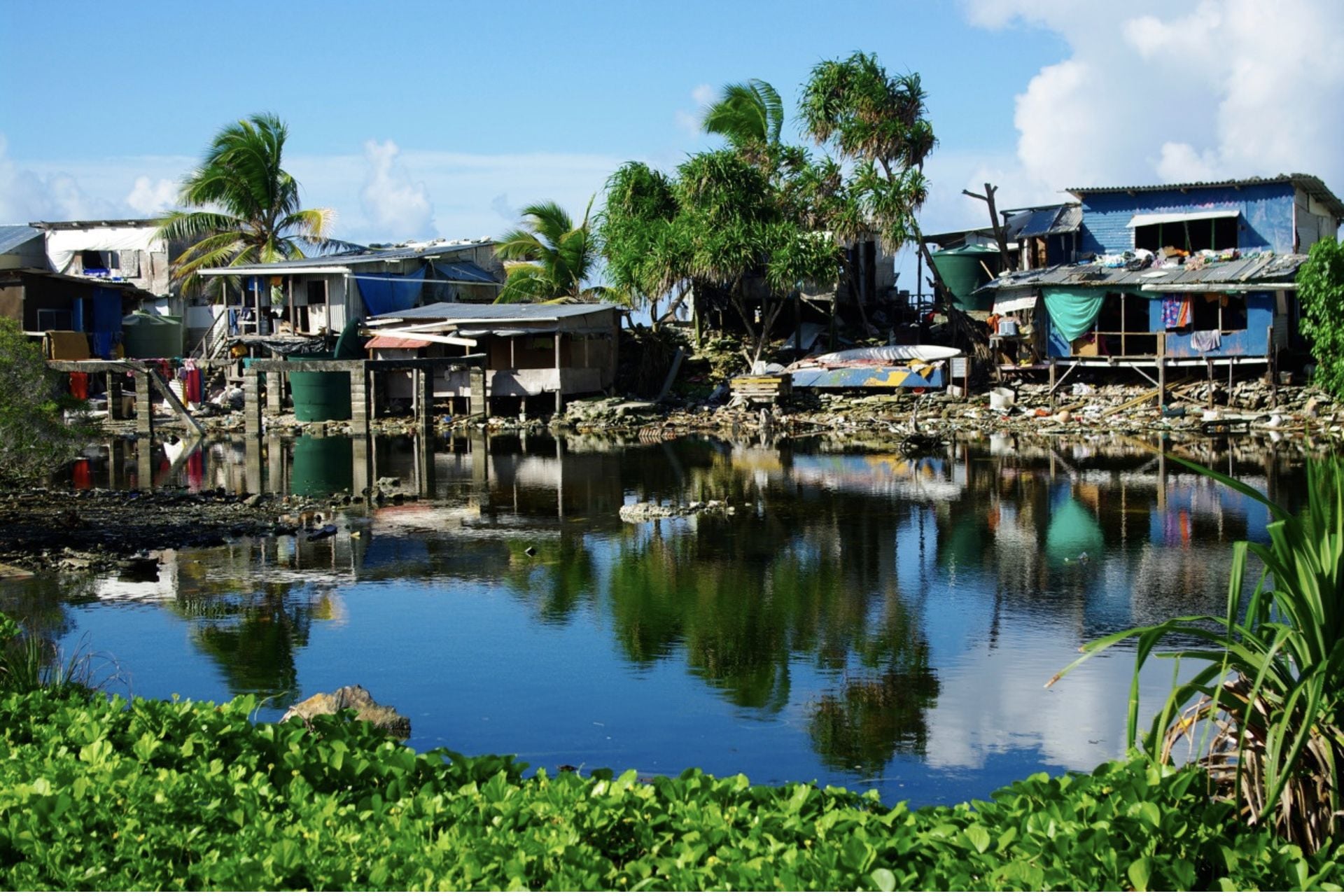 Floodwaters near homes in  Funafuti, Tuvalu