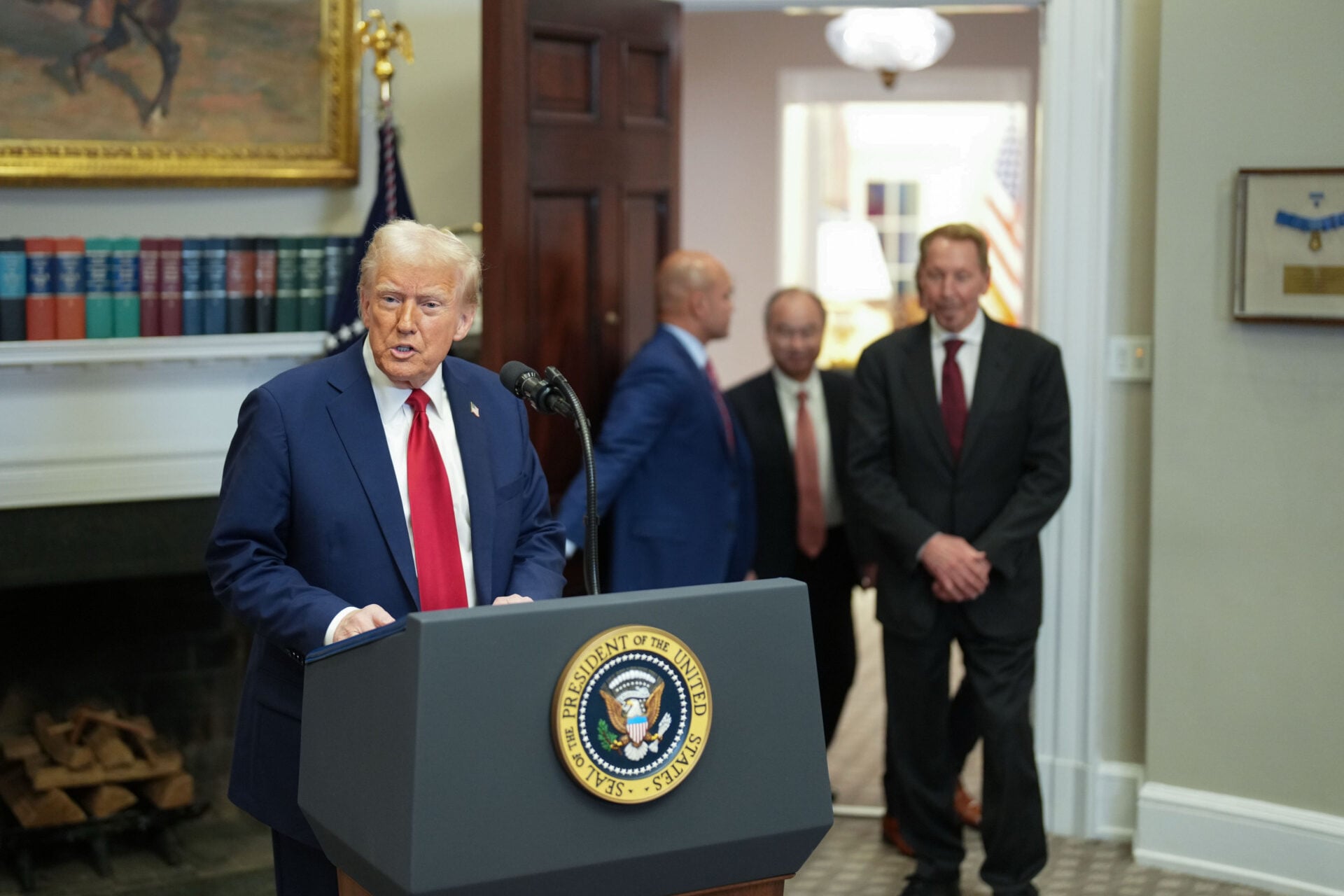 President Donald Trump, center, walks into the Roosevelt Room of the White House, with Masayoshi Son, chairman and CEO of SoftBank Group Corp, Larry Ellison, executive charmain Oracle, and Sam Altman, CEO of Open AI to deliver remarks about on AI infrastructure on January 21, 2025, in Washington, DC.