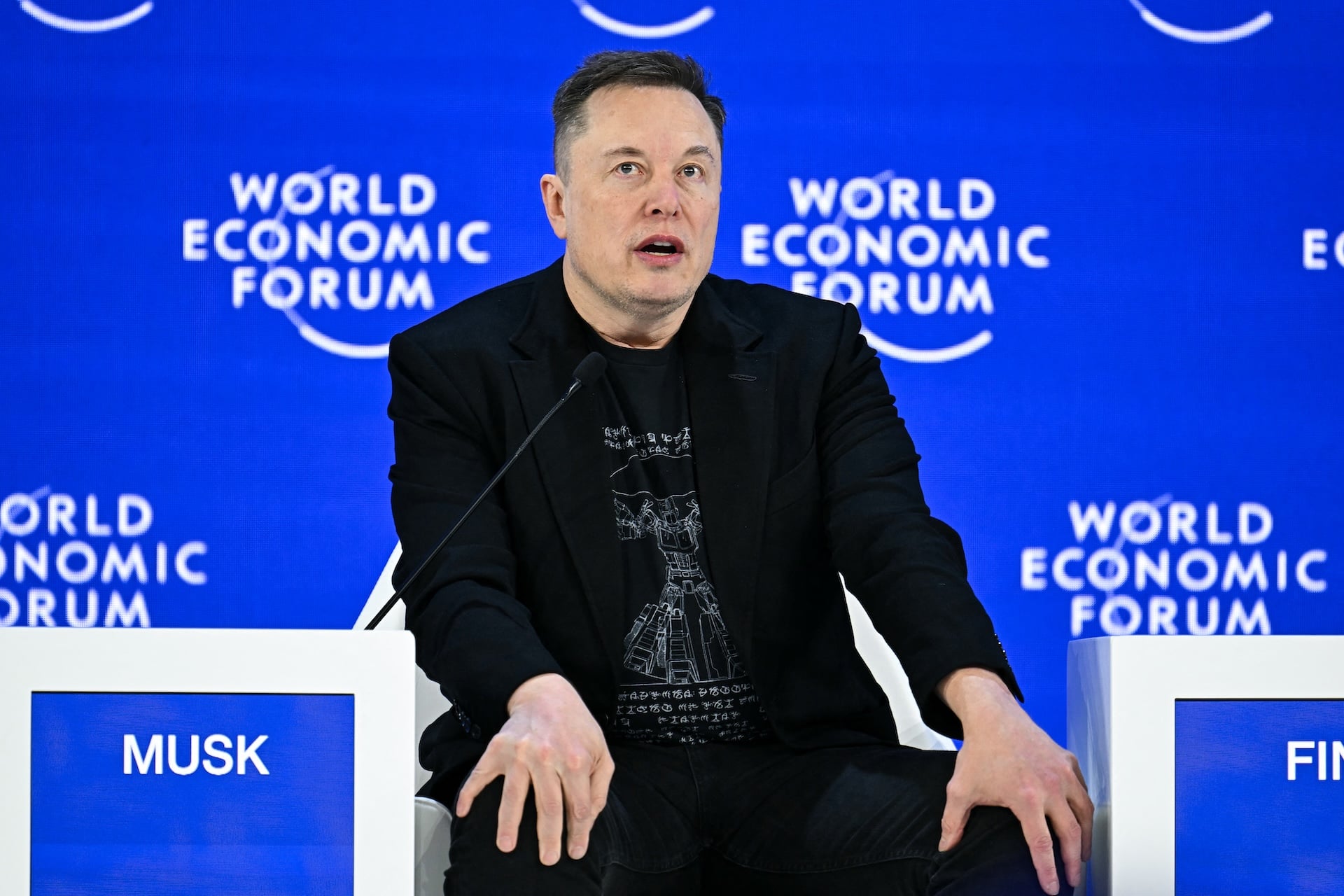 Elon Musk speaks during the World Economic Forum (WEF) annual meeting in Davos on January 22, 2026. 