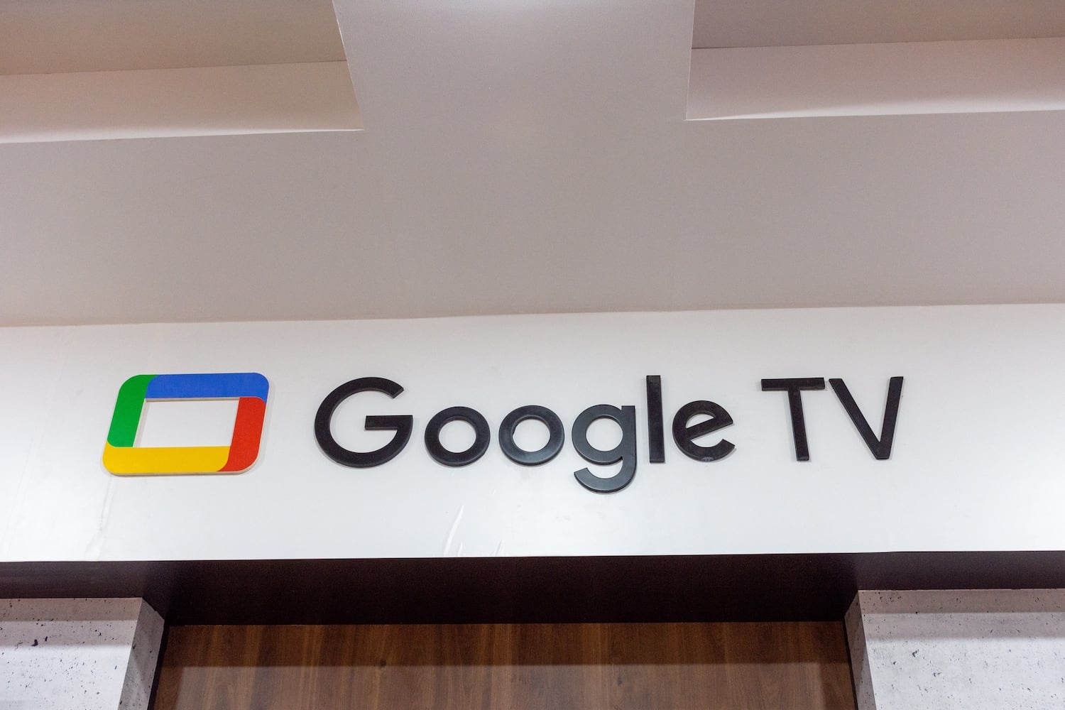 A Google TV sign on a wall at the Algerian Production Fair