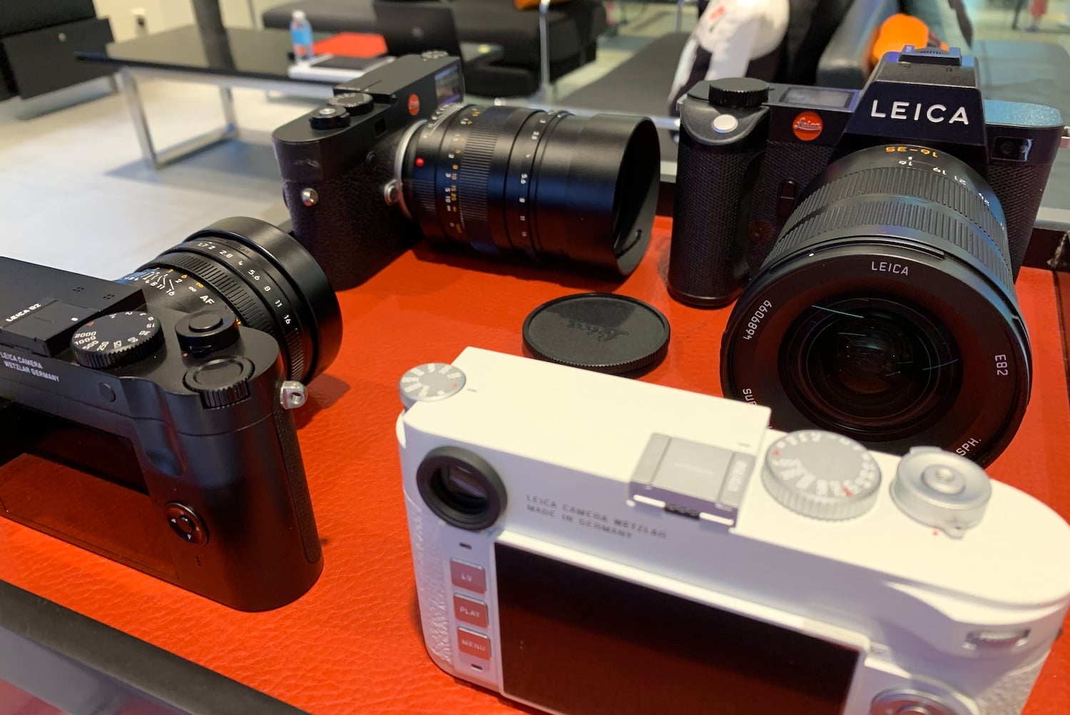 A store display with a bunch of Leica cameras