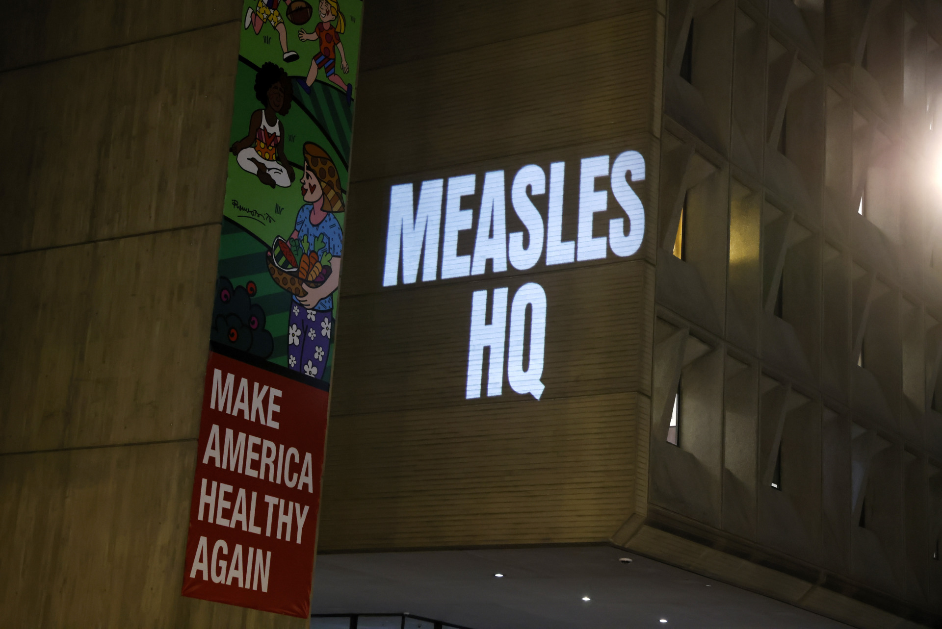 Protect Our Care shines light on the growing measles crisis under HHS Secretary Robert F. Kennedy, Jr. with a projection on the U.S. Department of Health and Human Services building on January 20, 2026 in Washington, DC.