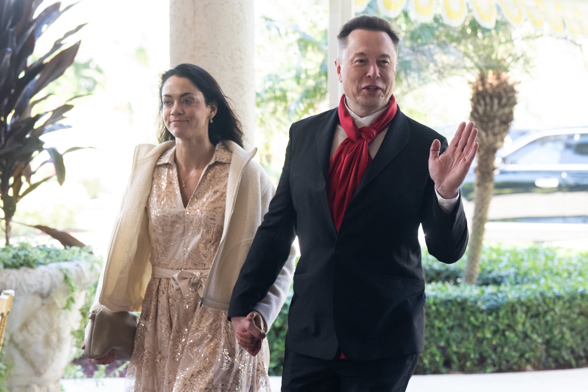 Elon Musk, CEO of Tesla and SpaceX, and Shivon Zilis, a venture capitalist, arrive to attend the wedding of Dan Scavino, White House Deputy Chief of Staff, and Erin Elmore, the Department of State Director of Art in Embassies, at Mar-a-Lago in Palm Beach, Florida, February 1, 2026.