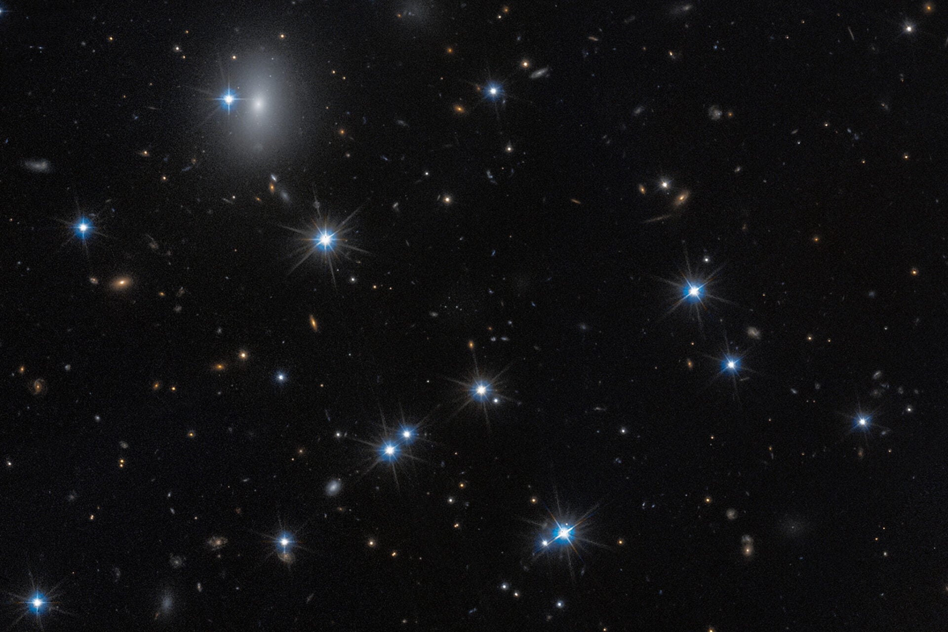 The low-surface-brightness galaxy CDG-2, shown in this image from the NASA/ESA Hubble Space Telescope, is dominated by dark matter and contains only a sparse scattering of stars. 
