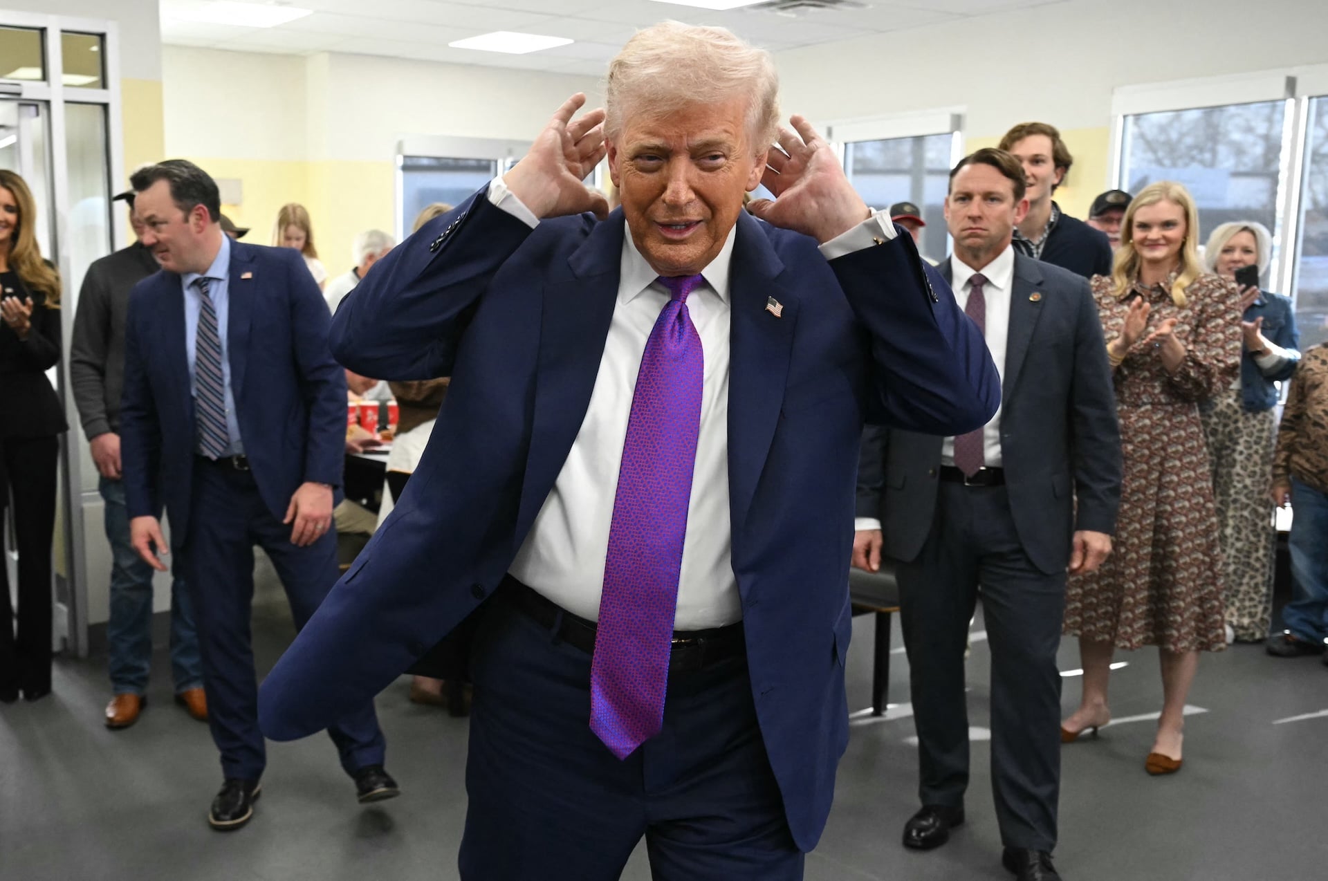 President Donald Trump gestures during a stop at The Varsity restaurant in Rome, Georgia, on February 19, 2026. 