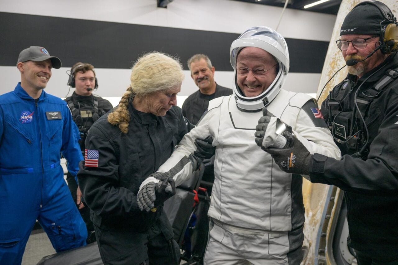 Crew 11 astronaut Mike Fincke gives a thumbs up as NASA personnel help him exit the Crew Dragon spacecraft