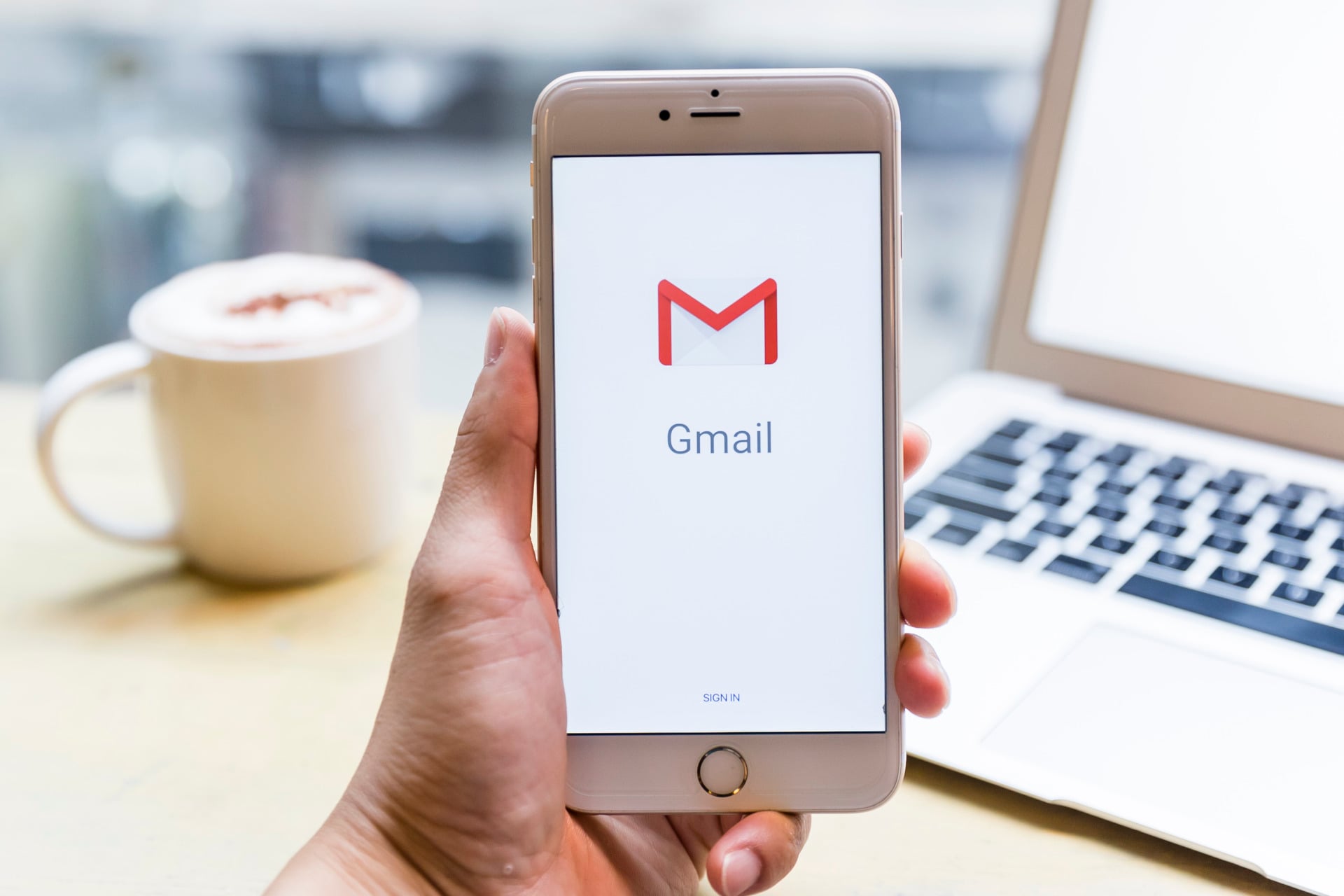 The Gmail logo displayed on an iPhone