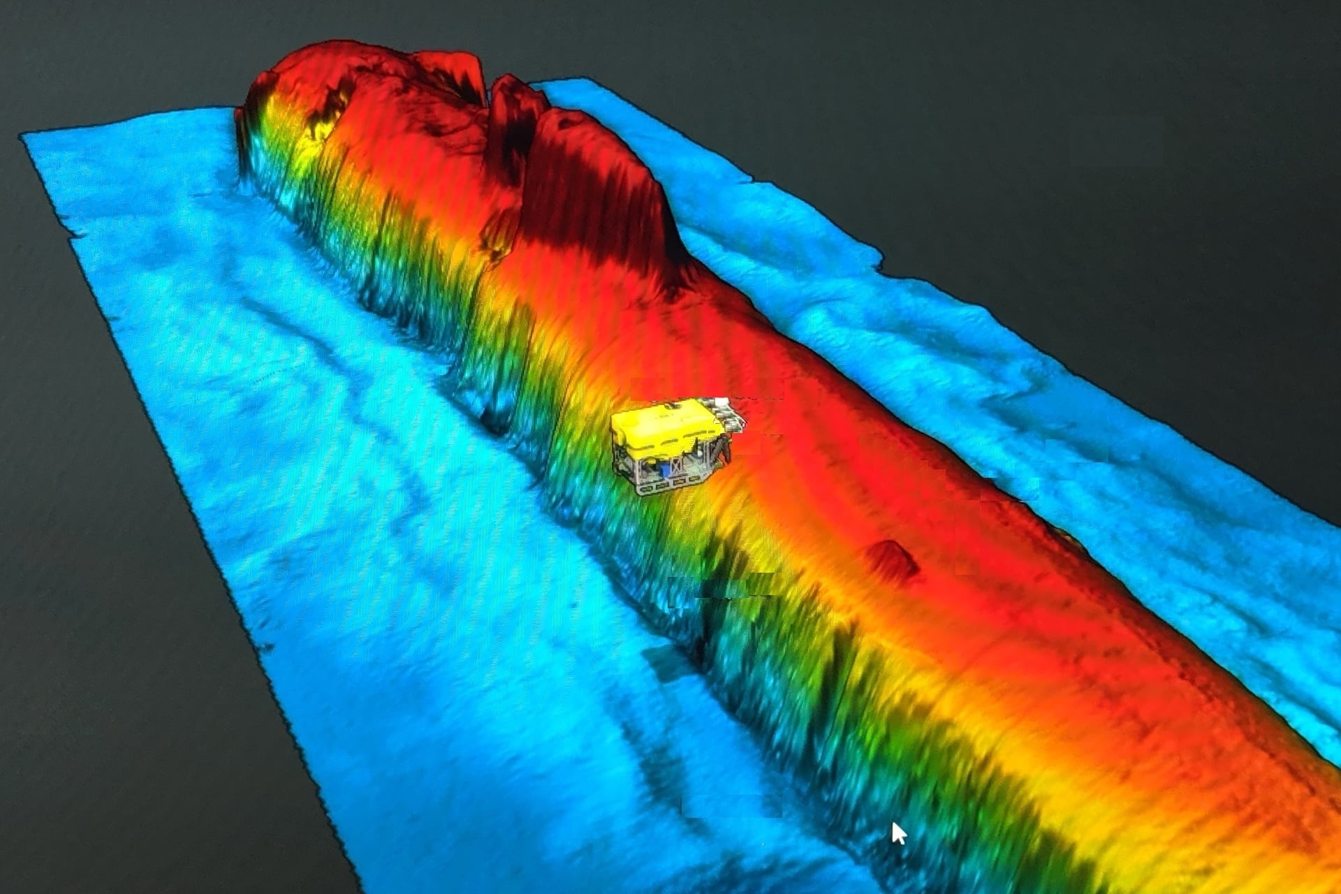 Above, a high-resolution sonar image scan of the sunken Soviet attack sub Komsomolets on the seafloor of the Norwegian Sea, taken in July 2019