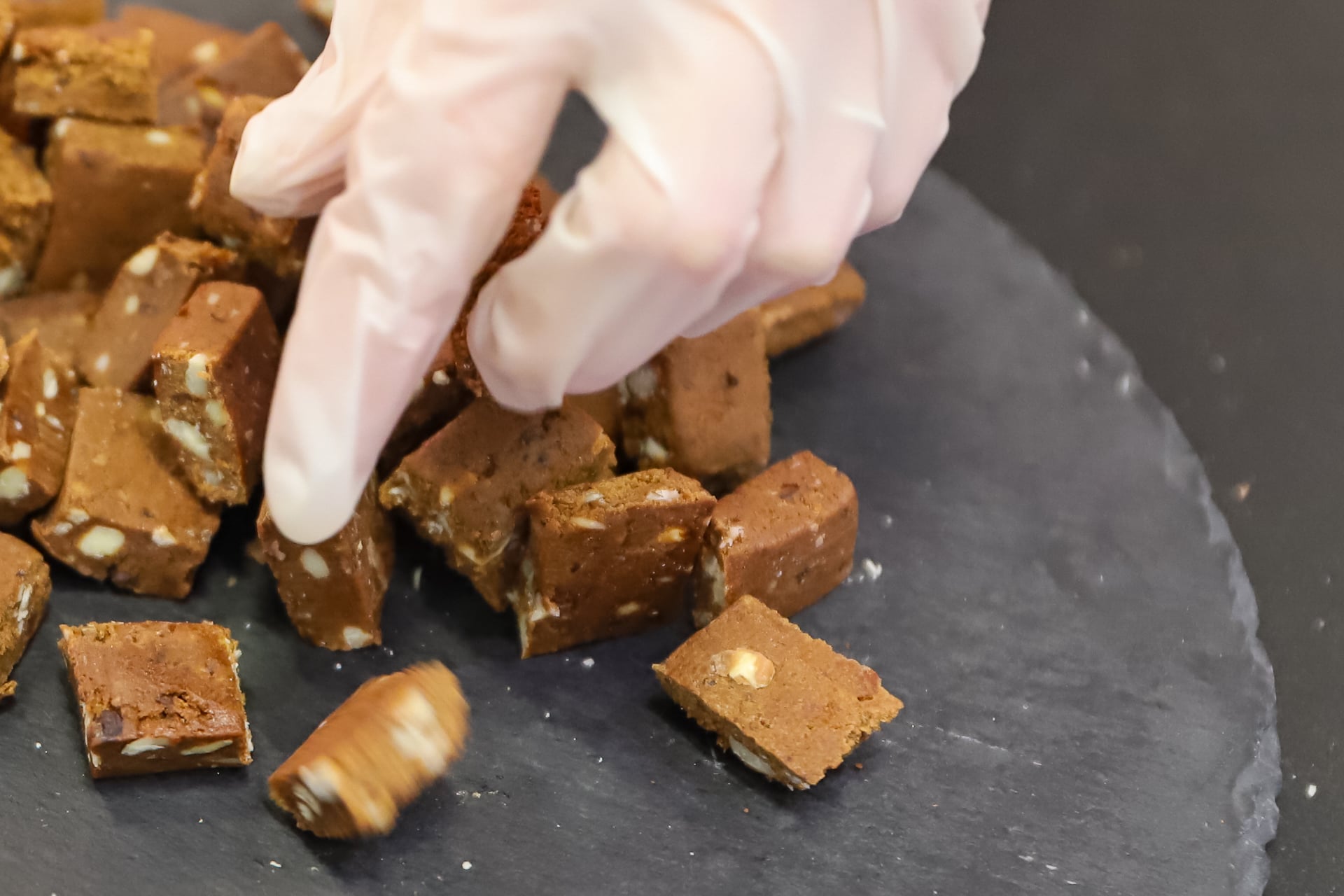 Above, a protein bar, cut up in sample sizes for presentation at the fitness trade show FIBO 2019 in Cologne, Germany.