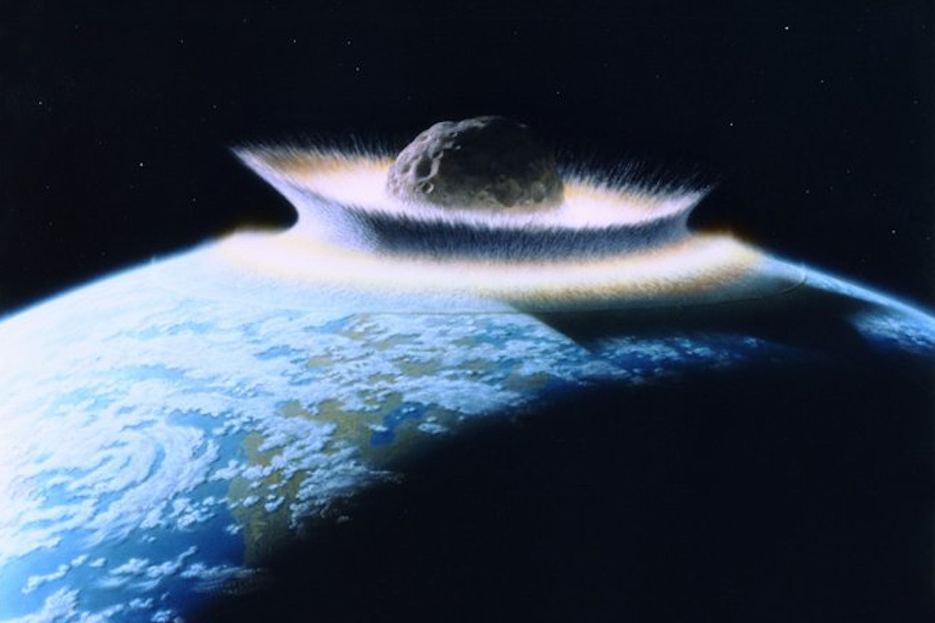 An illustration of an asteroid impact on Earth.