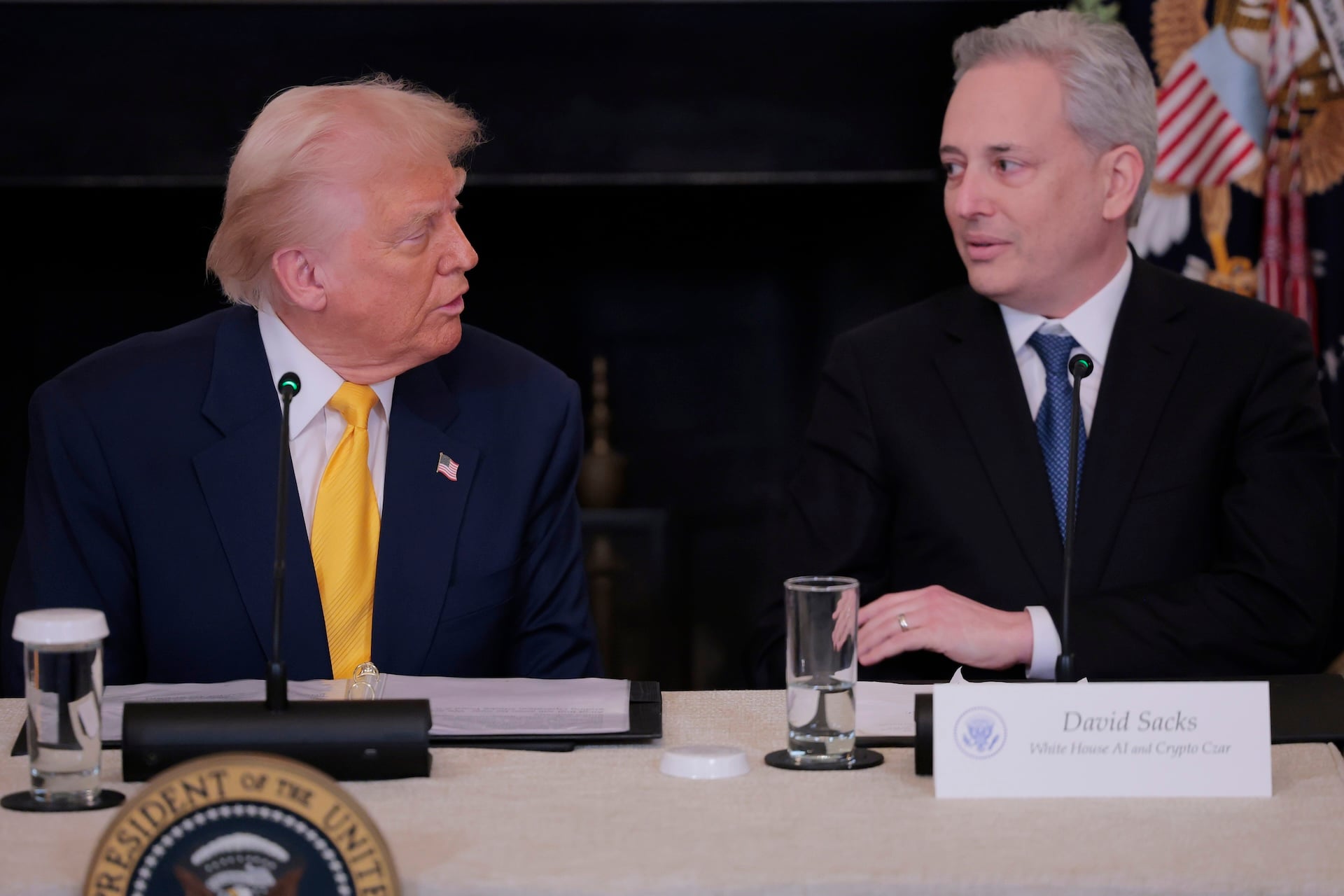 President Donald Trump speaks to David Sacks, U.S. President Donald Trump's AI and Crypto Czar during The White House Digital Assets Summit in the State Dining Room of the White House on March 07, 2025 in Washington, DC. 